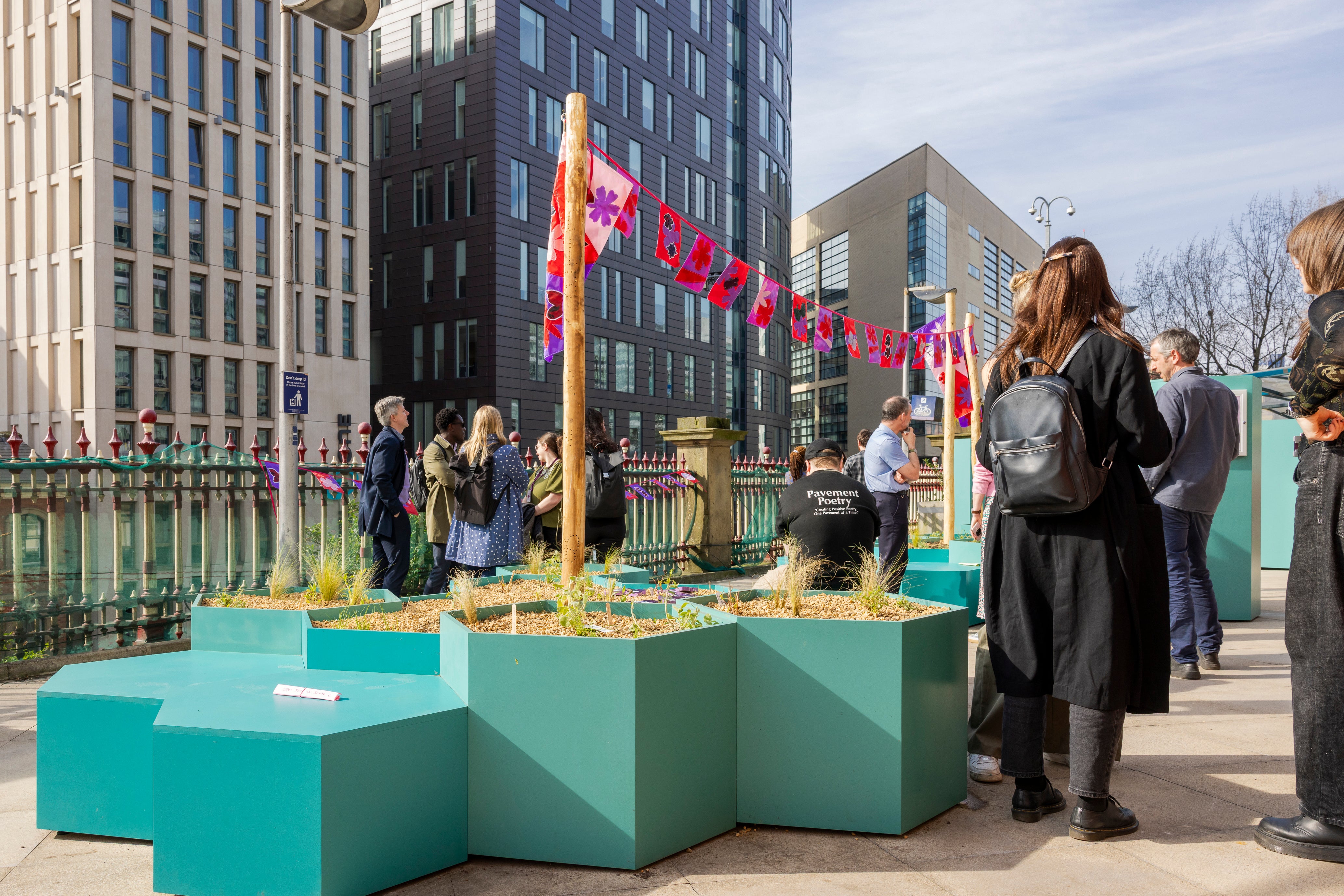 Visitors at the Station Sanctuary garden at Manchester Piccadilly