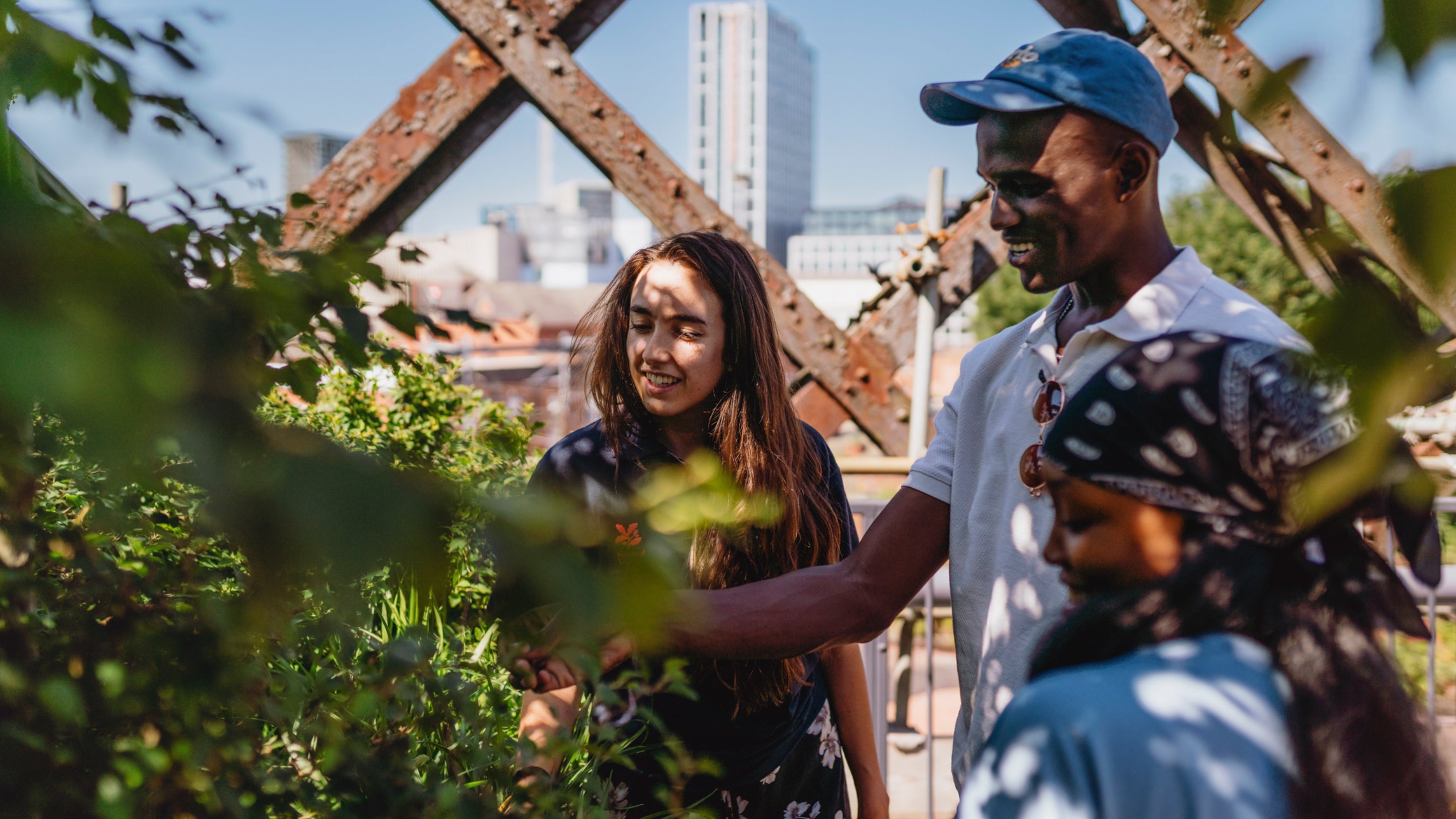 Visitors chatting with member of staff at Castlefield Viaduct, Manchester