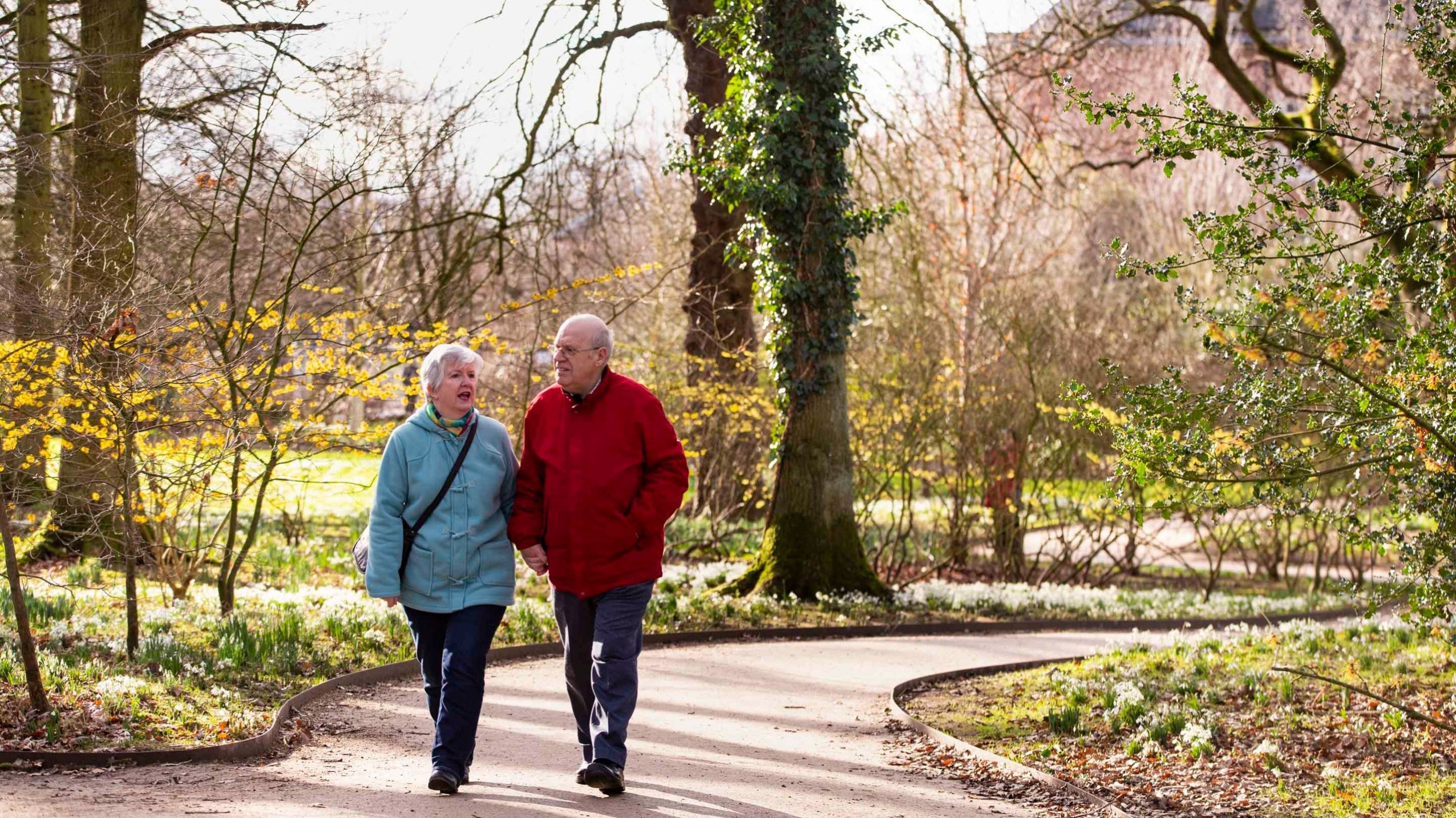 Visitors walking in the Winter Garden at Dunham Massey, Cheshire
