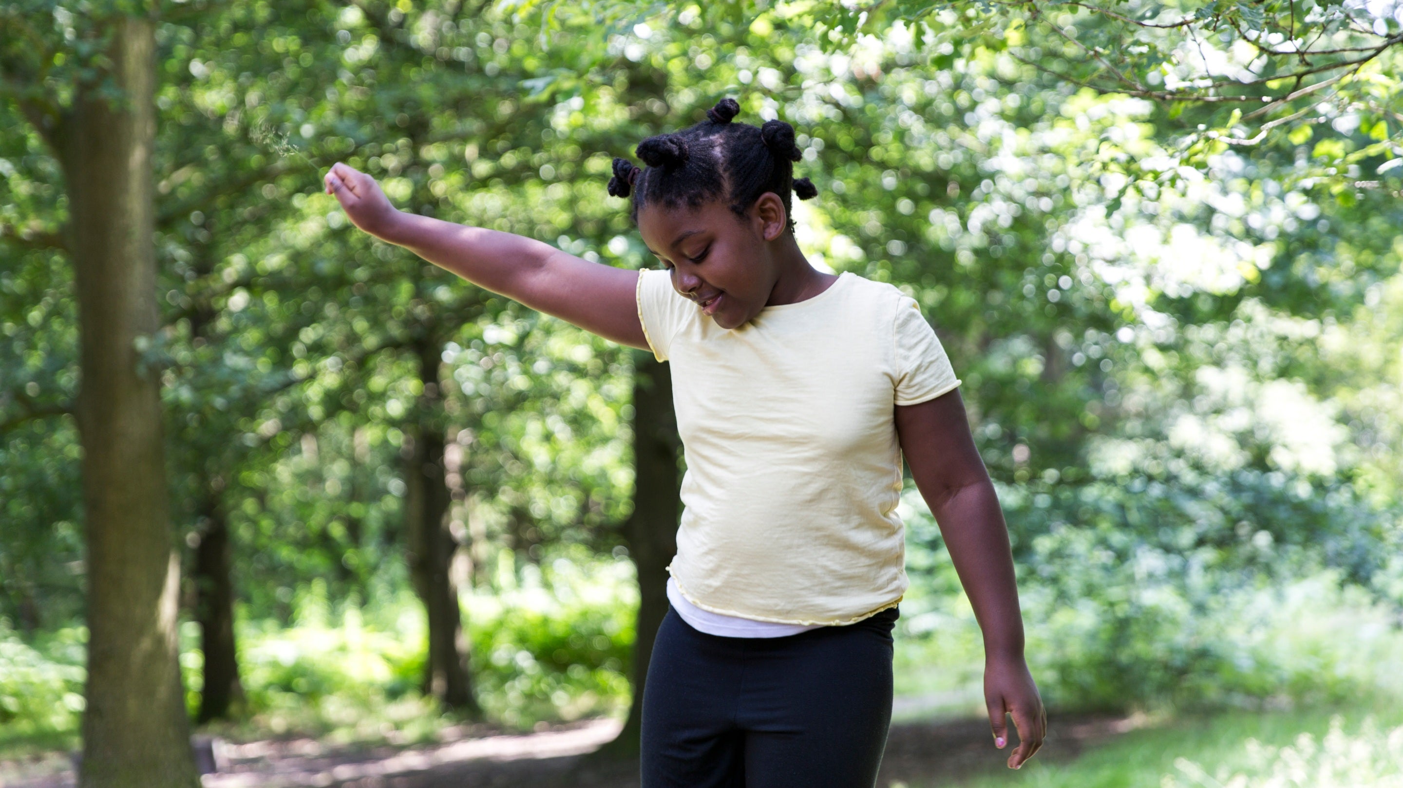 Girl in the natural play area at Dunham Massey, Cheshire