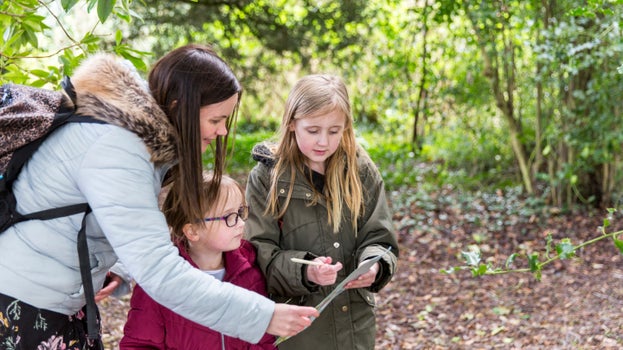 Family enjoying the Easter trail at Dunham Massey, Cheshire.