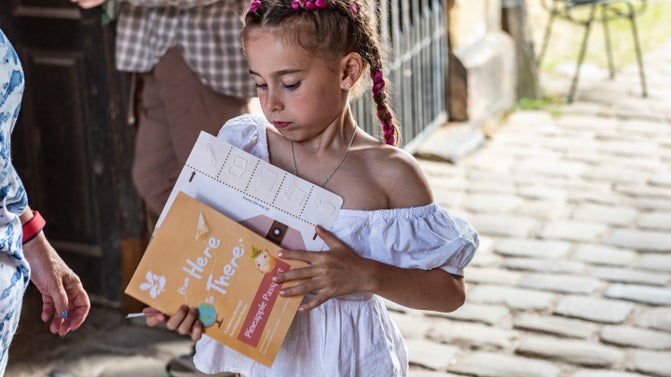 A young visitor with the house trail pack at Dunham Massey, Cheshire