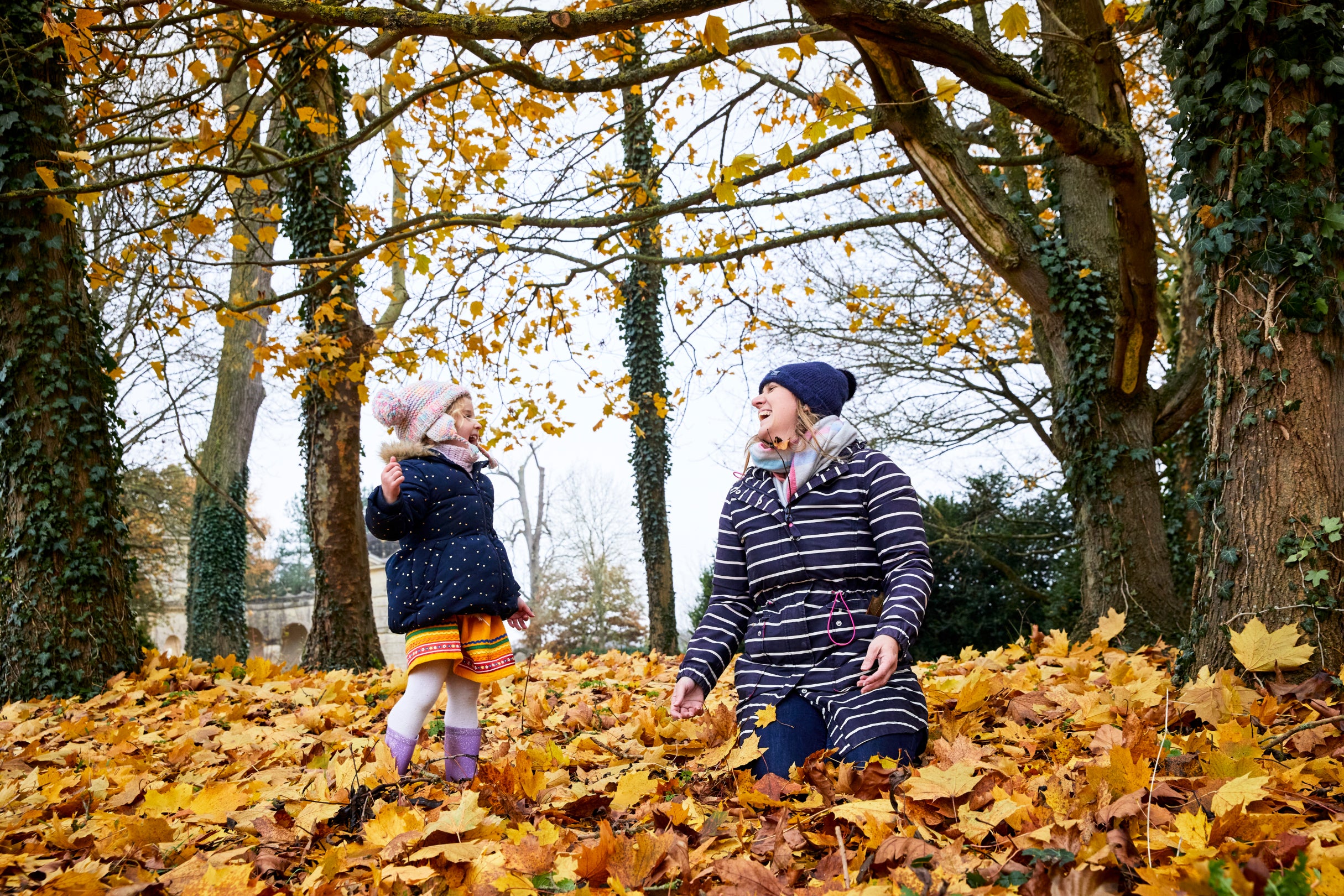 Family exploring gardens in autumn