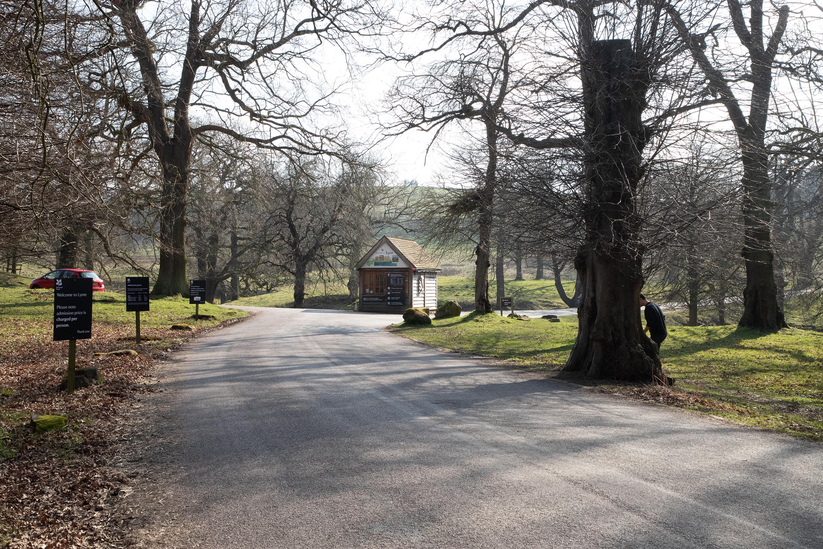 An old admissions hut, surrounded by trees