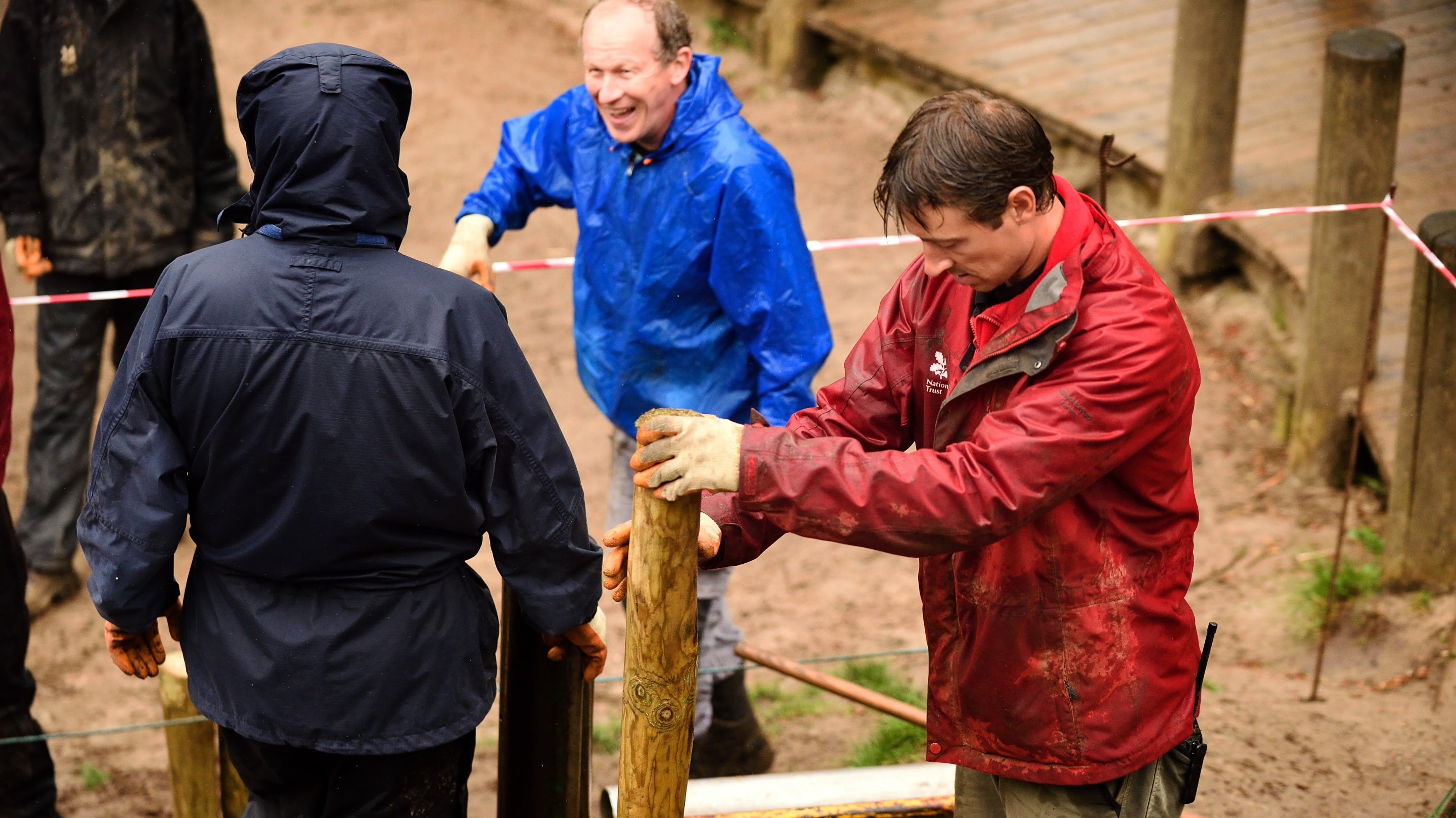 Ranger working with volunteer rangers to build steps and a pathway at Lyme Park, Cheshire