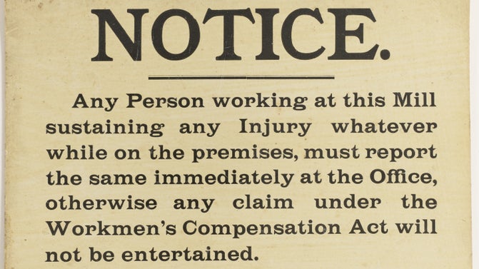 A sign with black writing