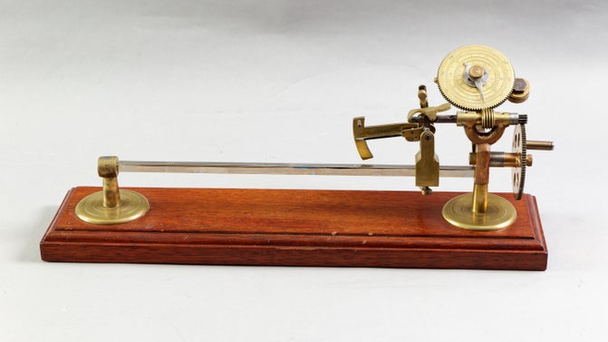 A wood and metal piece of equipment