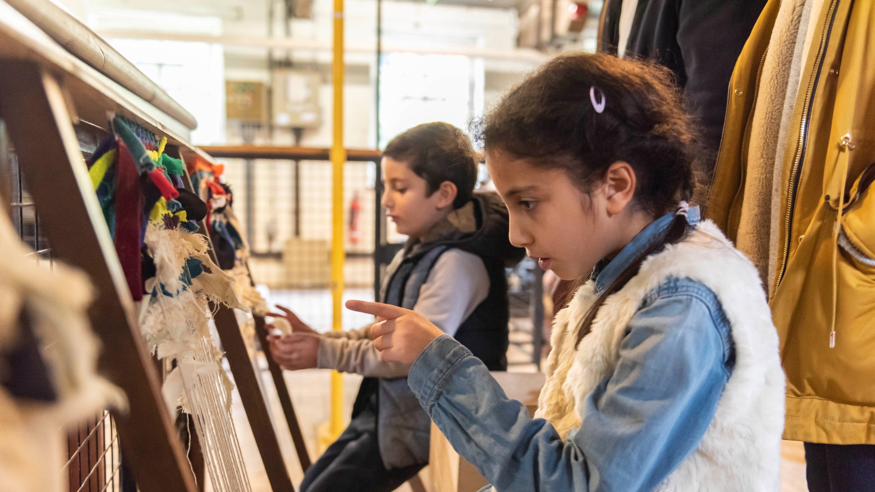 Doing a weaving activity at Quarry Bank Mill, Cheshire