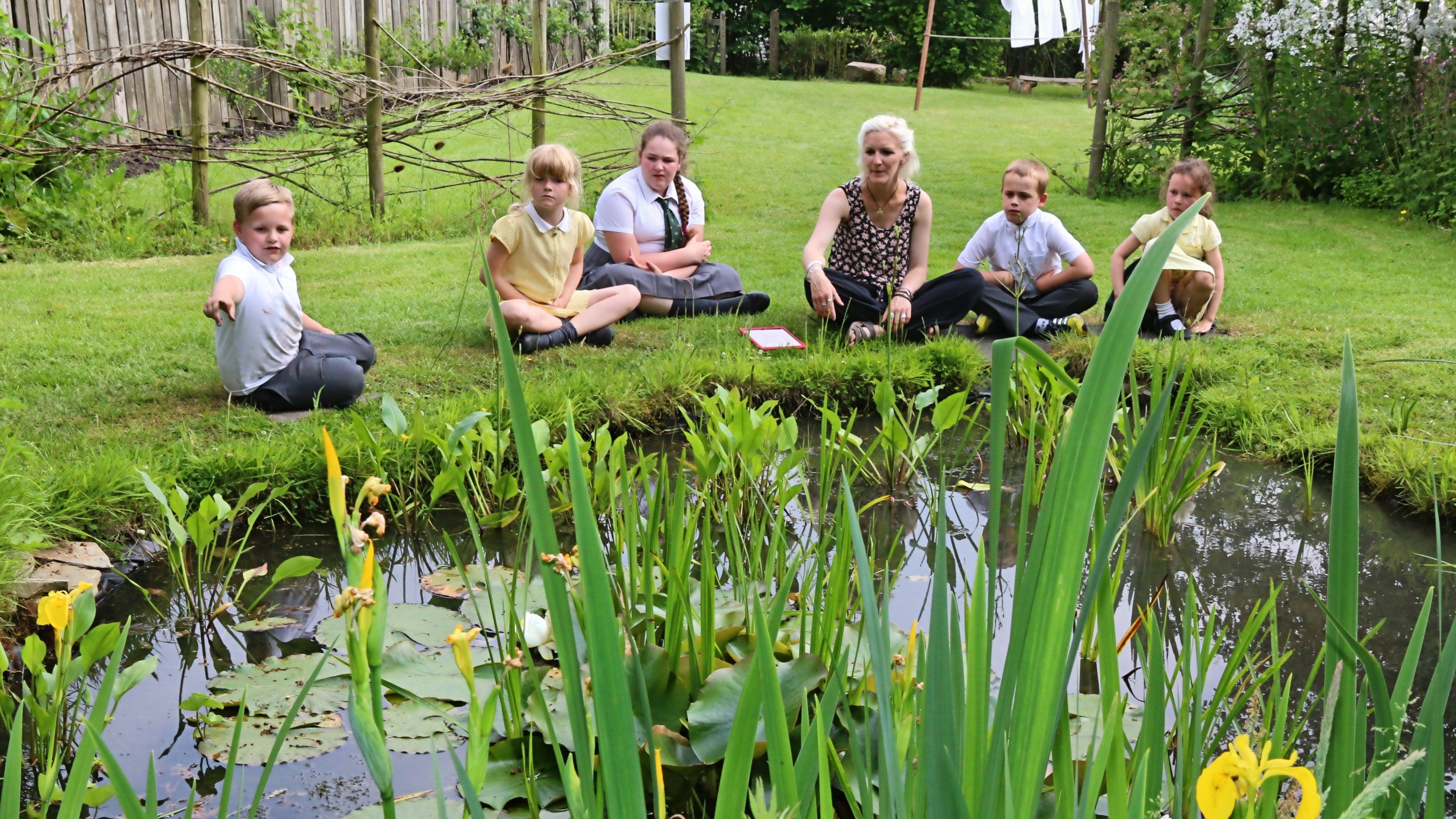 Schoolchildren in the Apprentice House garden at Quarry Bank Mill, Cheshire