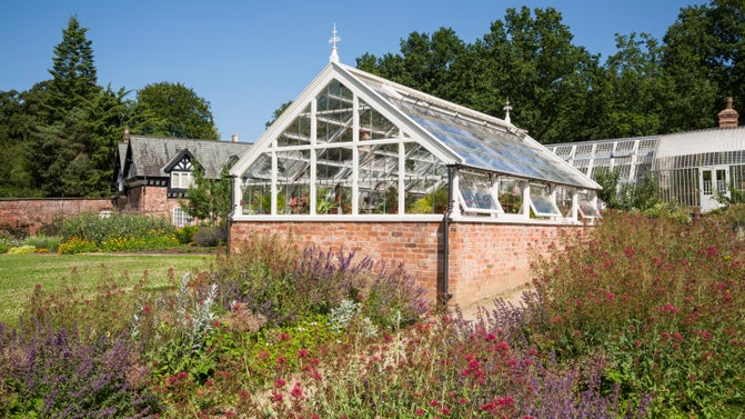 The glasshouses and gardener's cottage at Quarry Bank