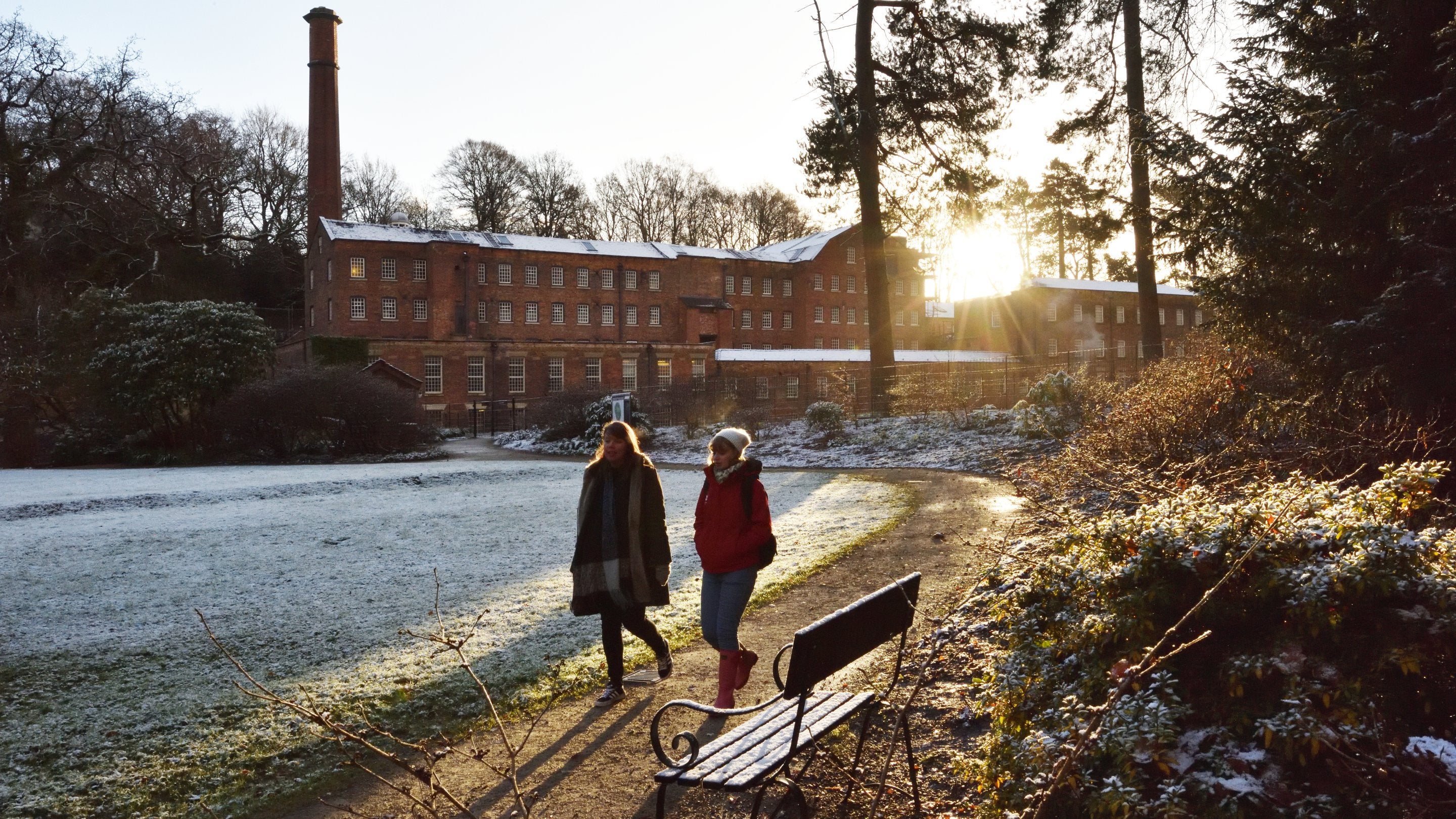 Visitors exploring the garden in winter at Quarry Bank Mill, Cheshire