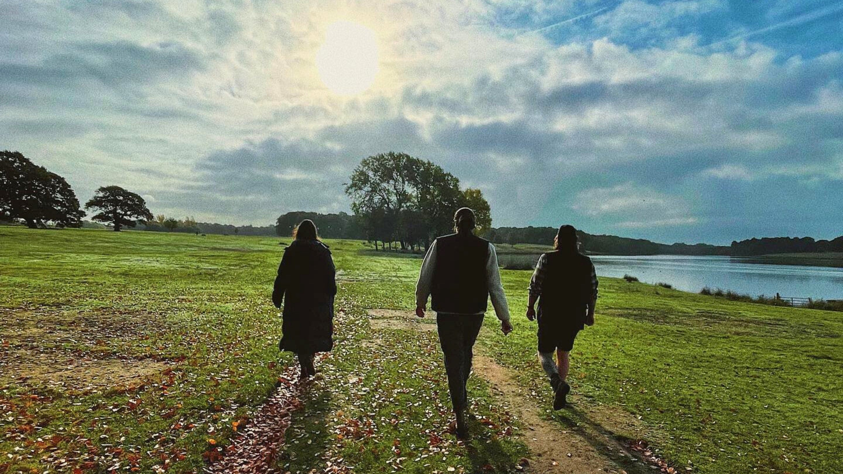Visitors walking through the parkland, Tatton Park, Cheshire