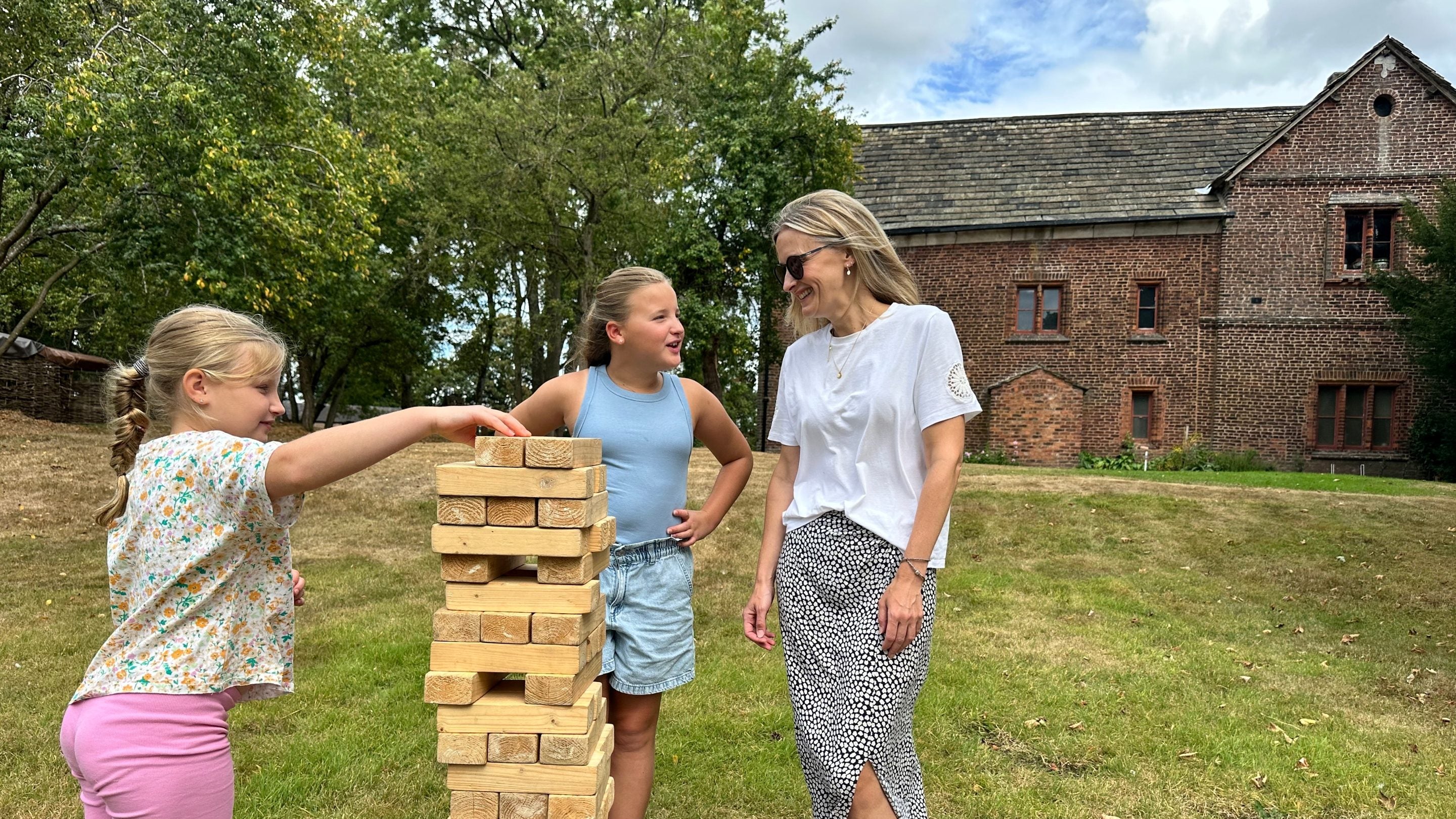 Visitors playing outdoor games at an Old Hall Open Day at Tatton Park, Cheshire