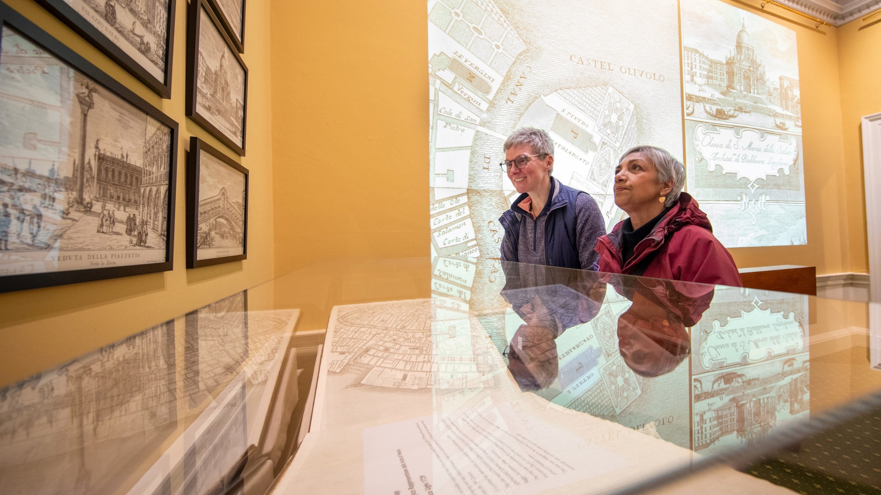 Visitors looking at the Ughi map at the Beyond the View exhibition in the Mansion, Tatton Park