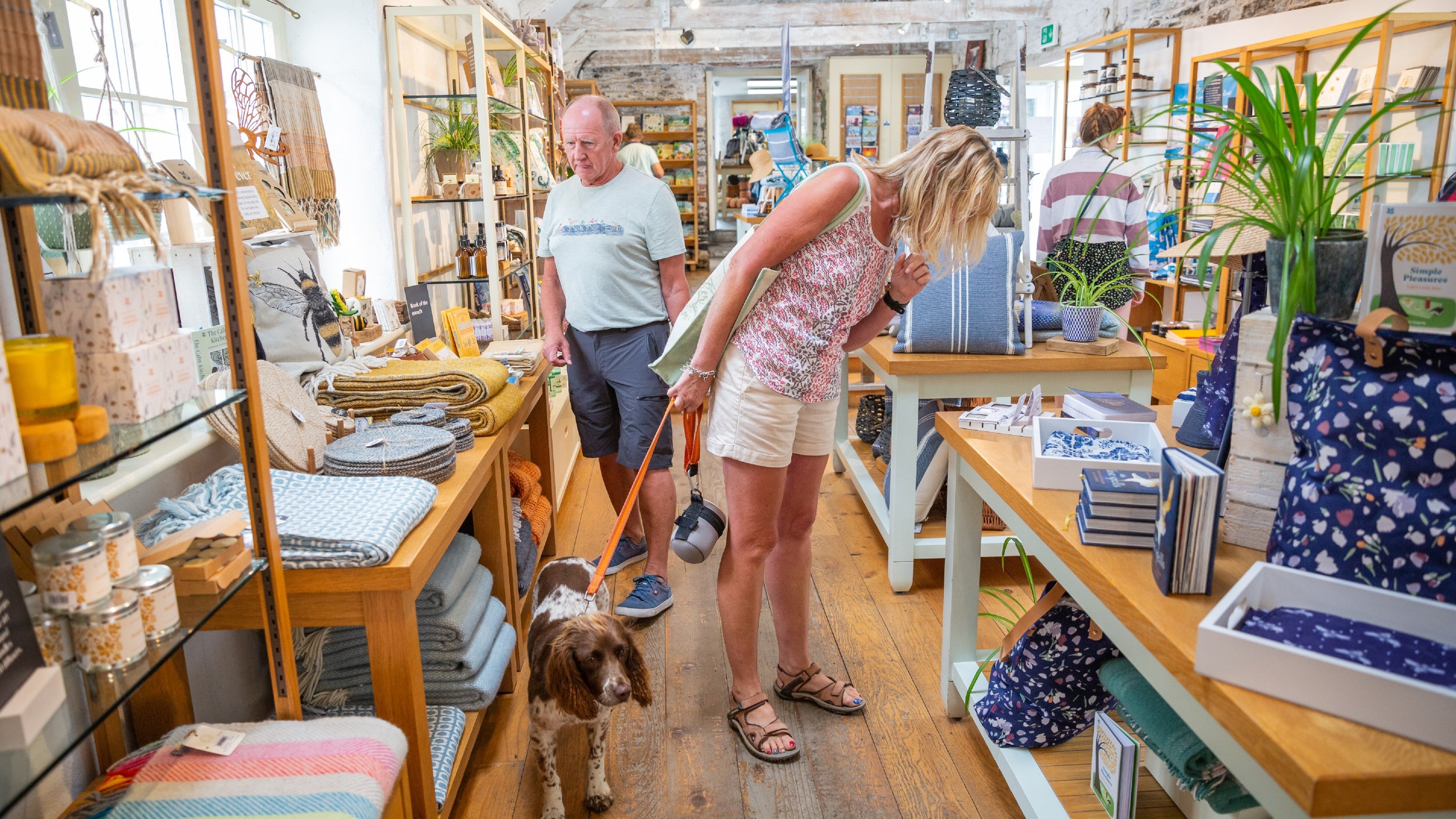 Visitors browsing in the shop at Boscastle, Cornwall