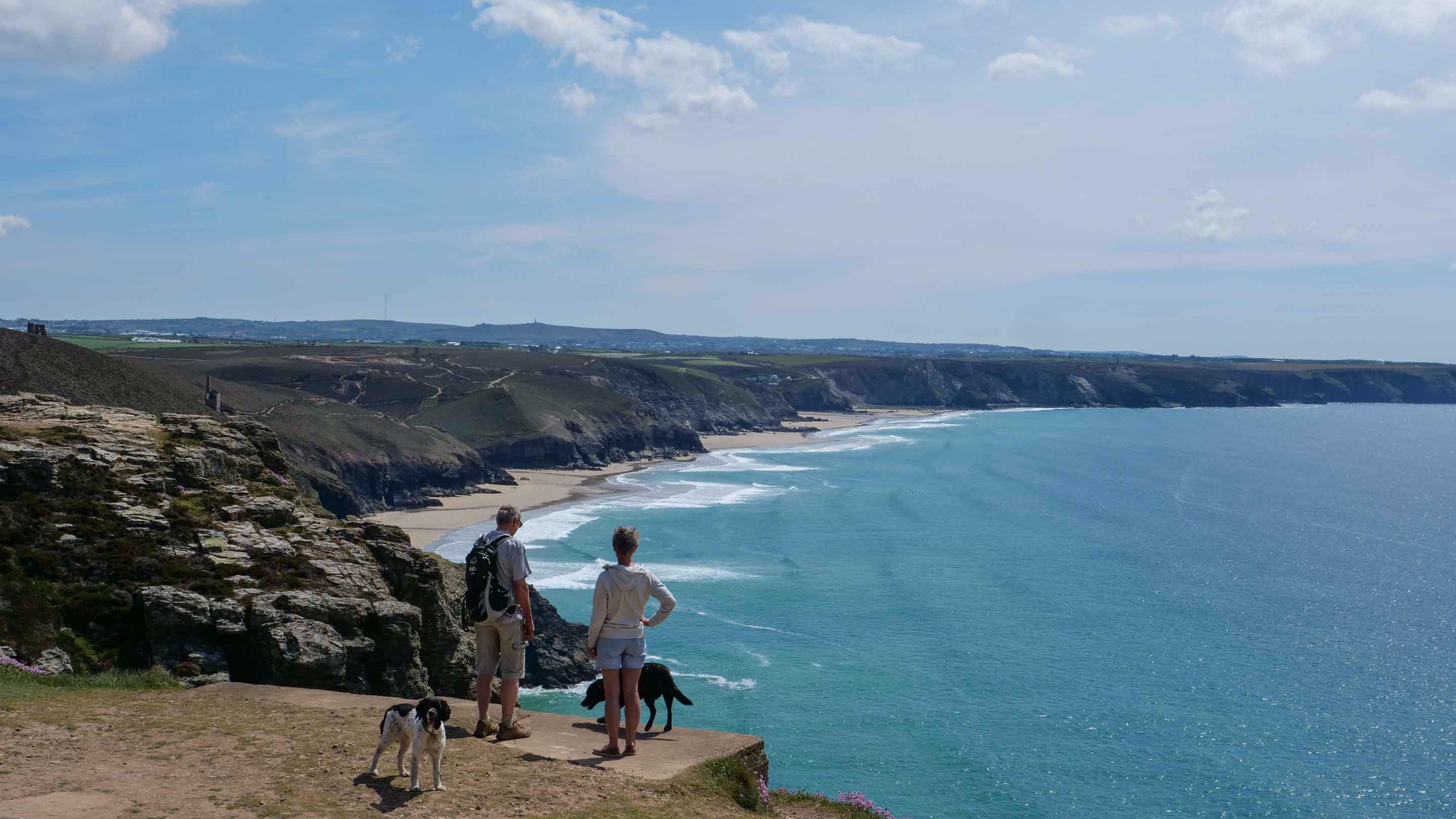 Walkers stopping to take in the view, Chapel Porth, Cornwall