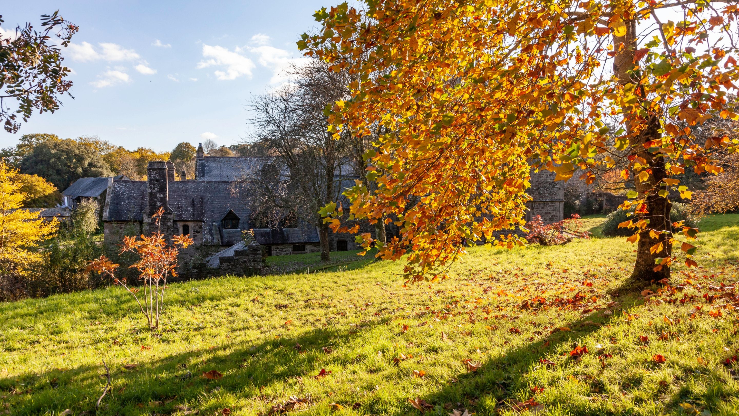 The house and garden on a sunny day in autumn at Cotehele, Cornwall