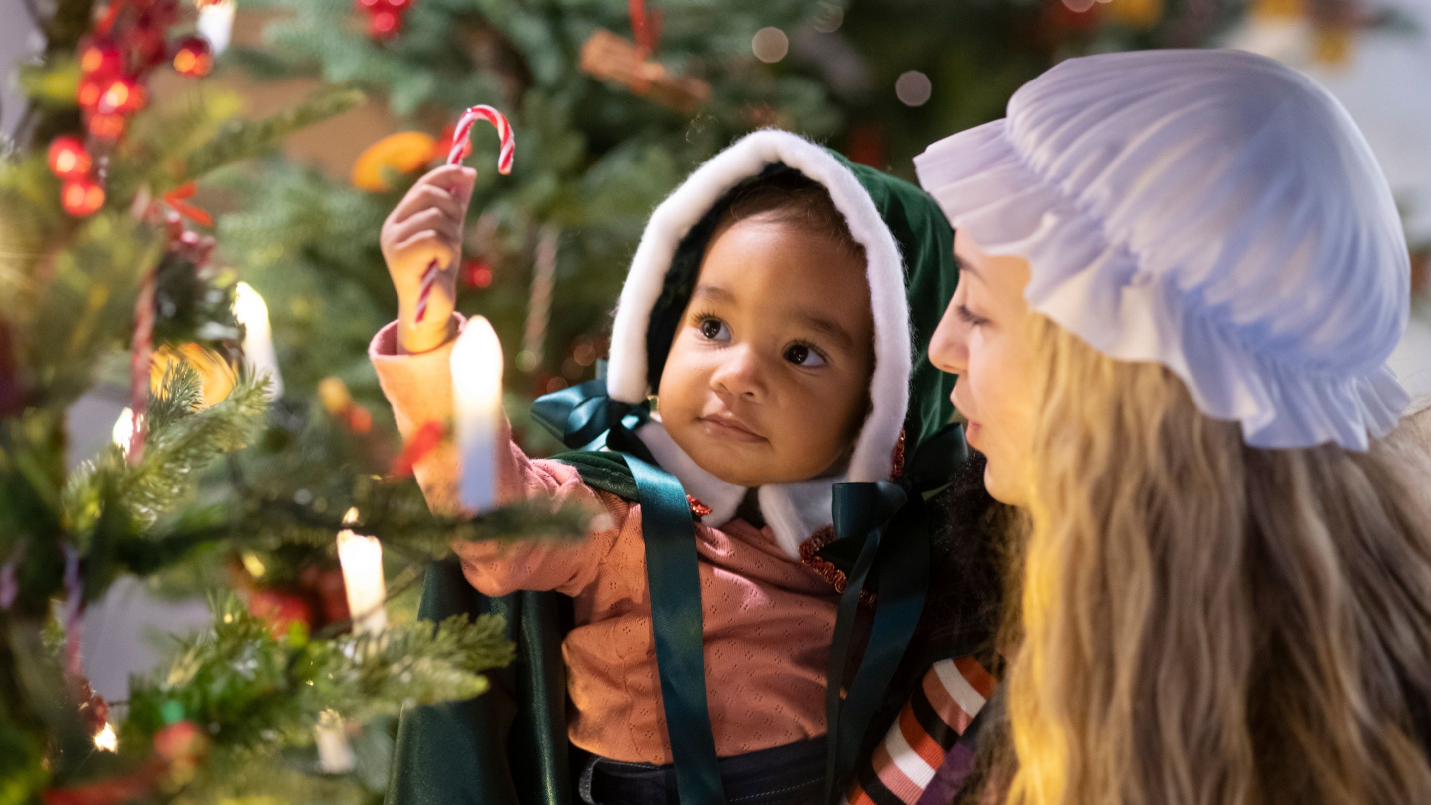 Visitors admiring the decorations at Cotehele Mill, Cornwall