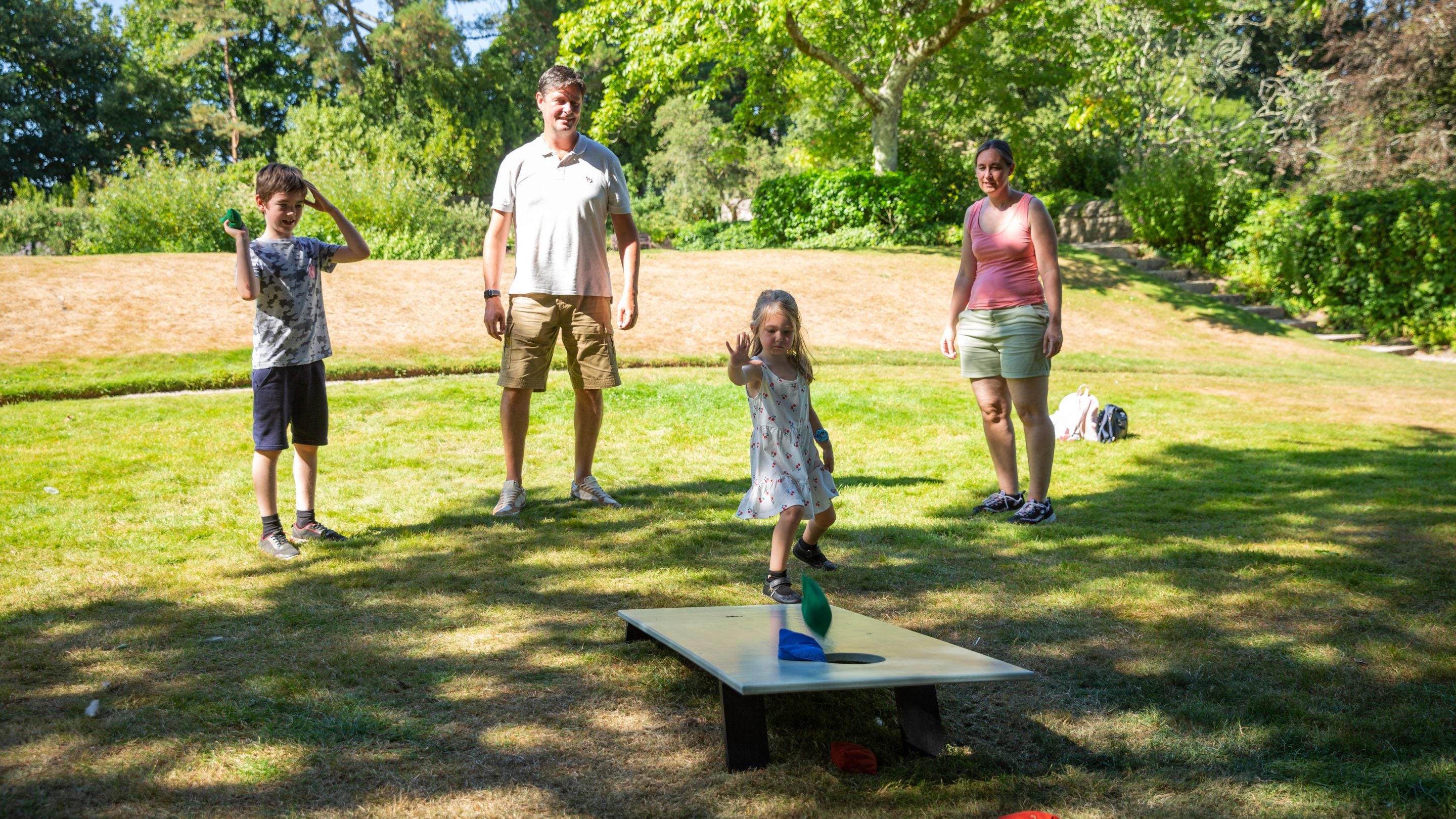 A family enjoying one of the summer play activities at Cotehele, Cornwall