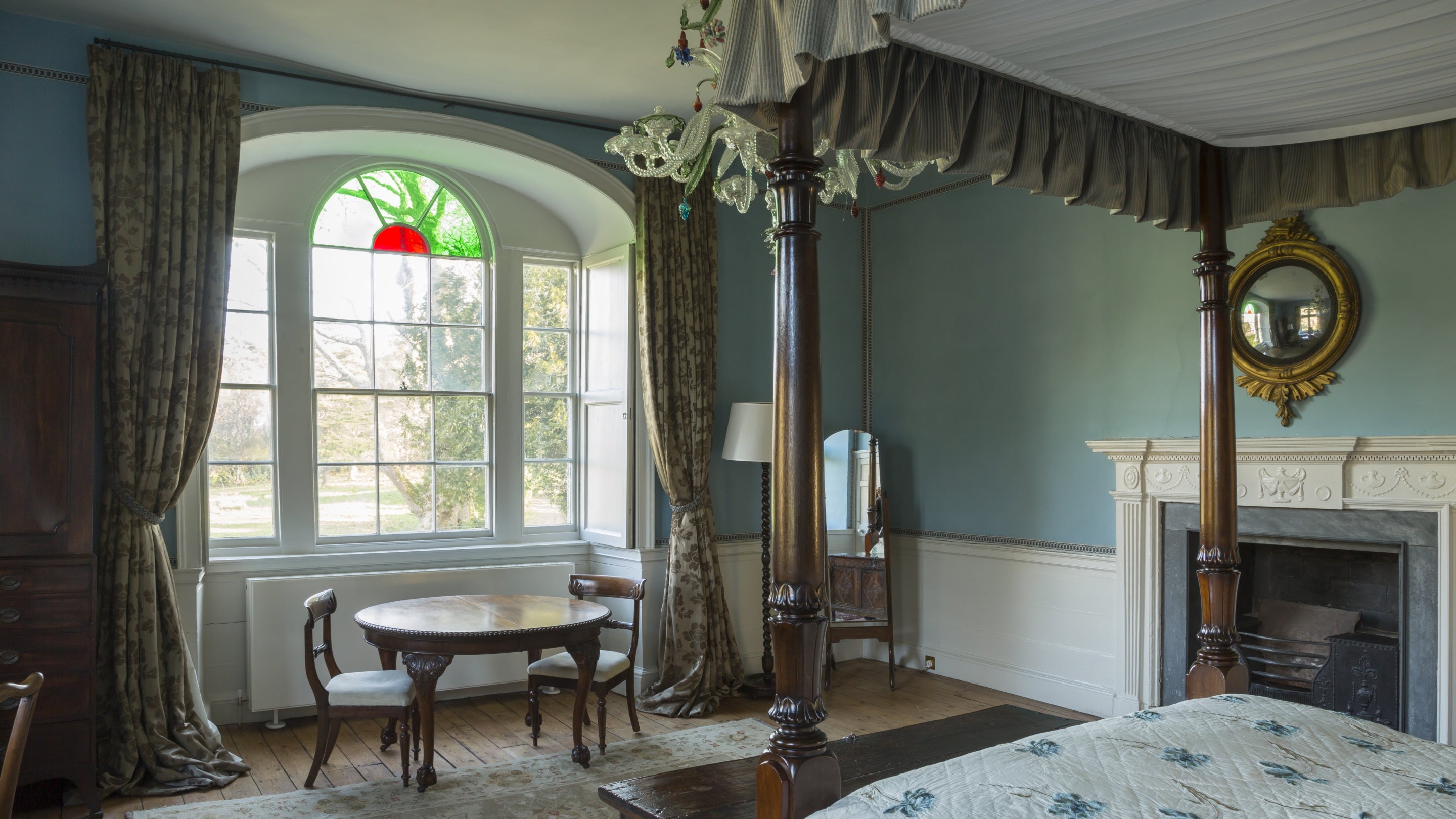 A view of the arched window from inside the main bedroom at Godolphin, Cornwall