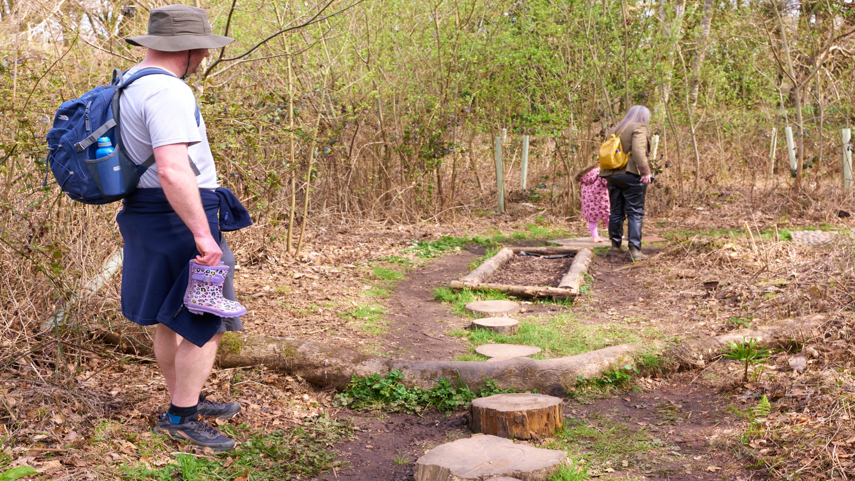 Family enjoying the barefoot trail at Godolphin.