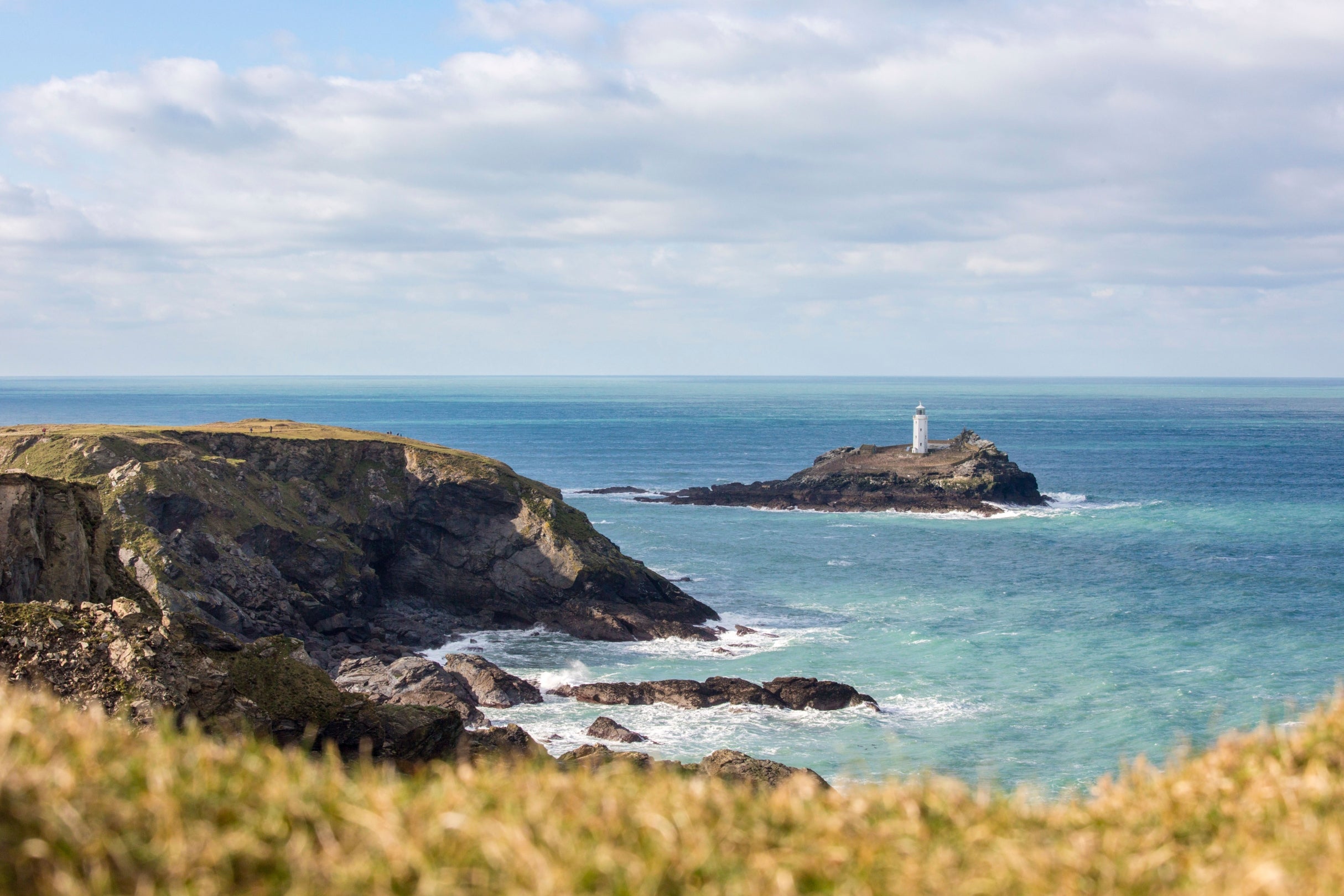 A view of Godrevy lighthouse from the cliffs. The sea is looking a little rough but it is blue