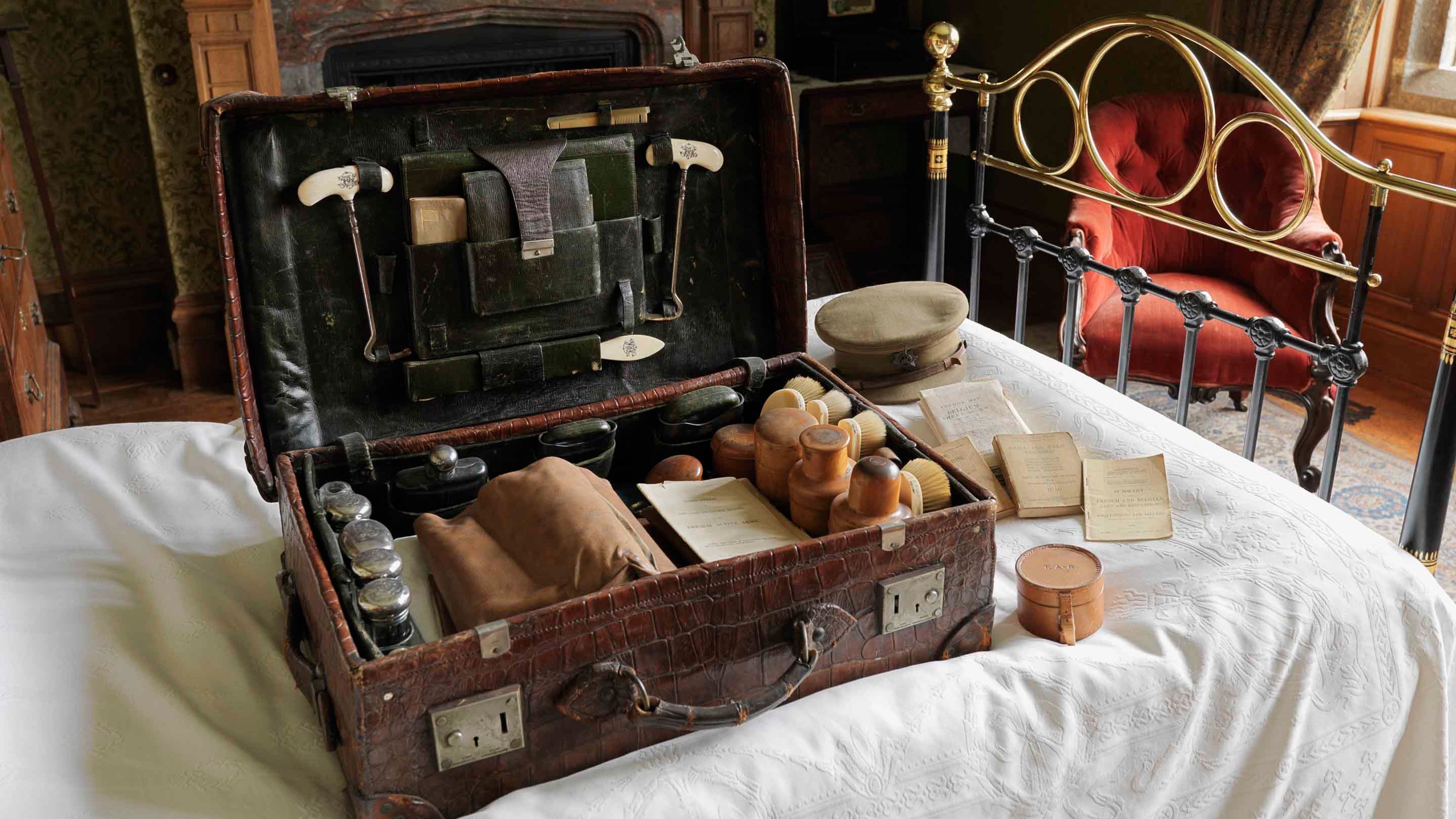 The travelling case used by Captain Tommy Agar-Robartes during the First World War, displayed alongside other items in his bedroom at Lanhyrdock, Cornwall.