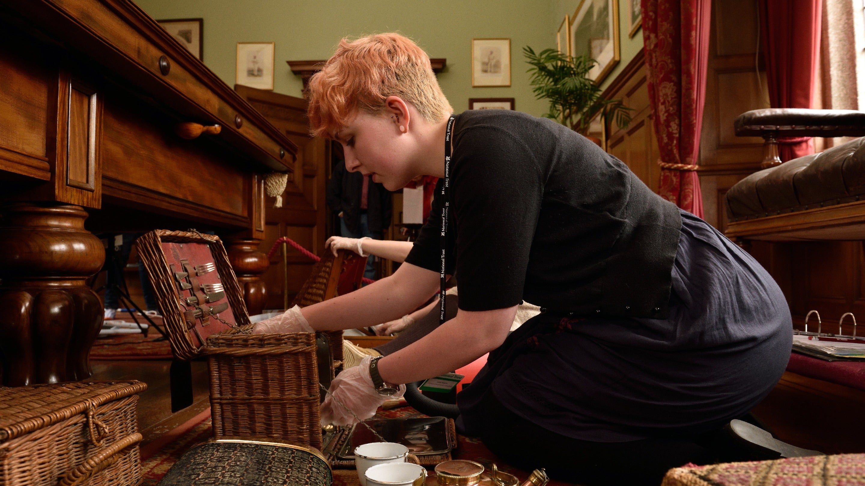 Staff cleaning the collection at Lanhydrock in Cornwall