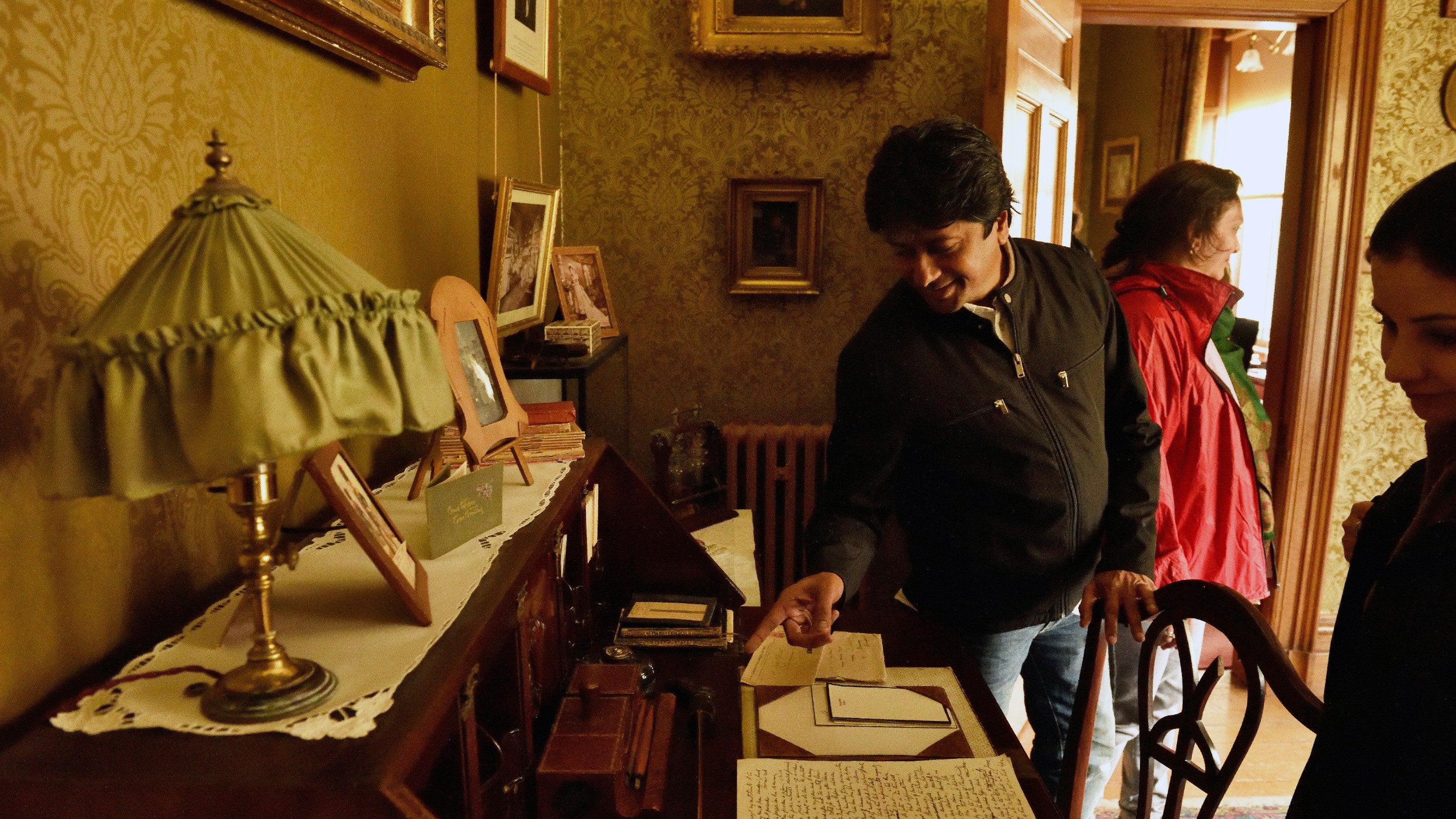 Visitors explore the house at Lanhydrock in Cornwall
