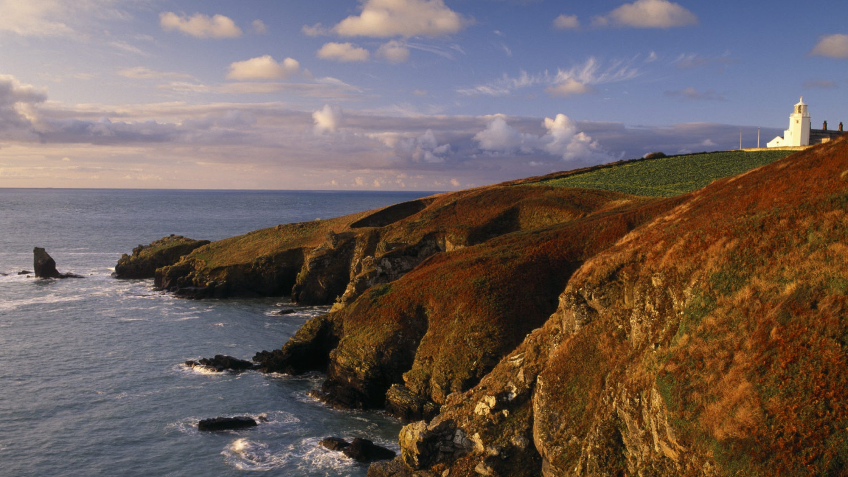 Lighthouse on the Lizard Peninsula, with Bumble Rock and the Lions Den, Cornwall