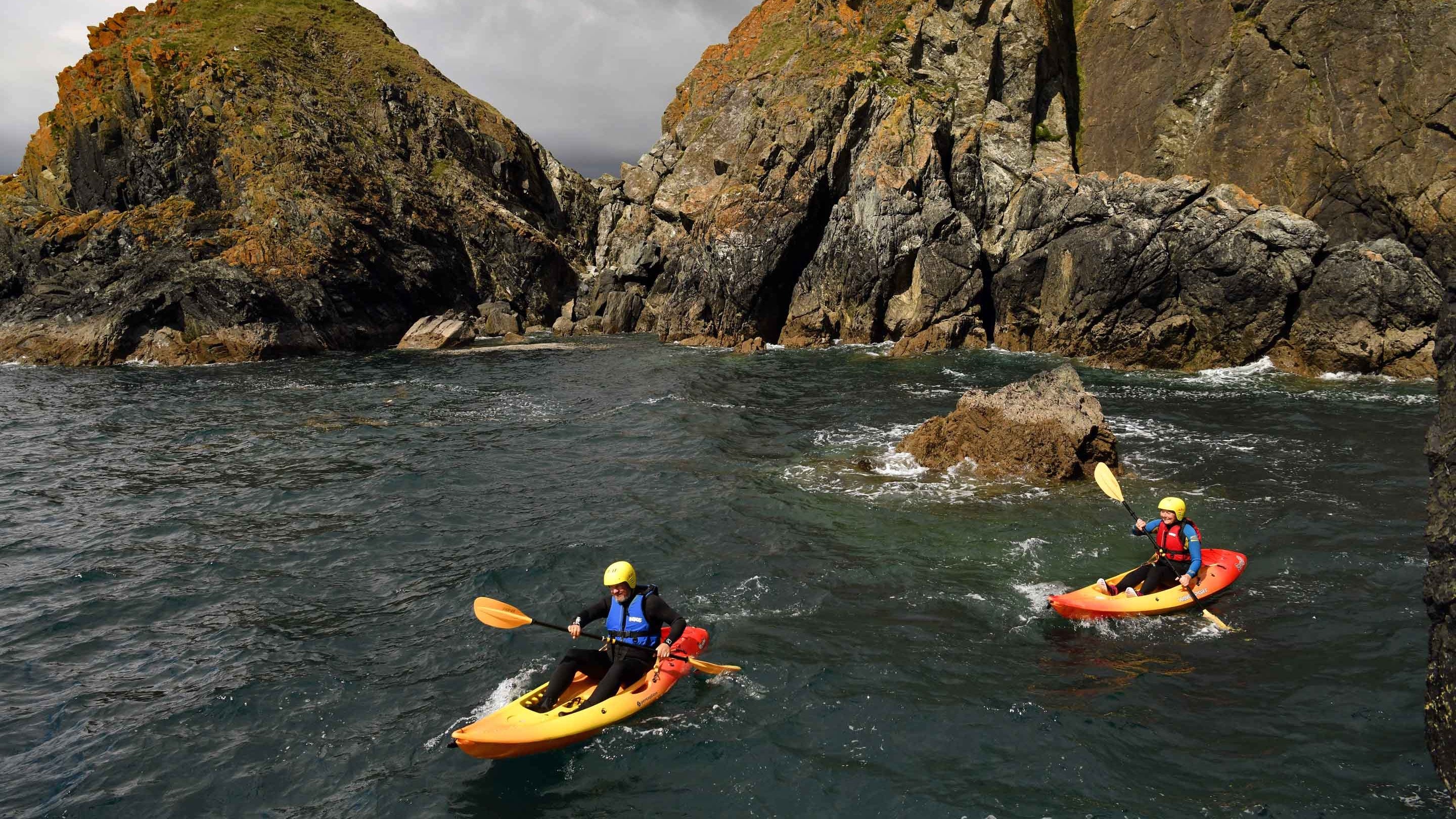Sea kayaking at Poldhu Cove, Cornwall