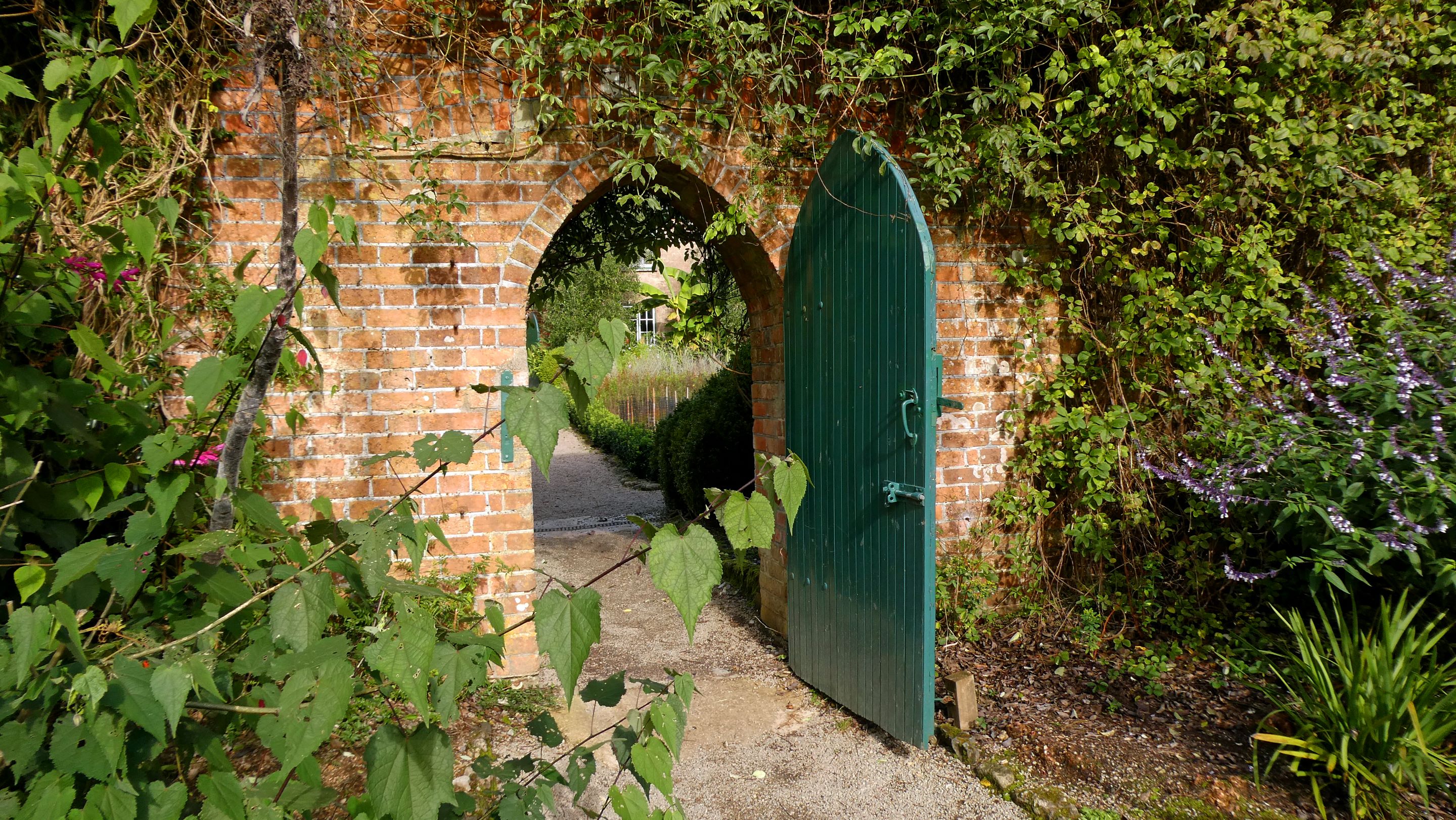 Brick arch into walled kitchen garden Trengwainton, Cornwall