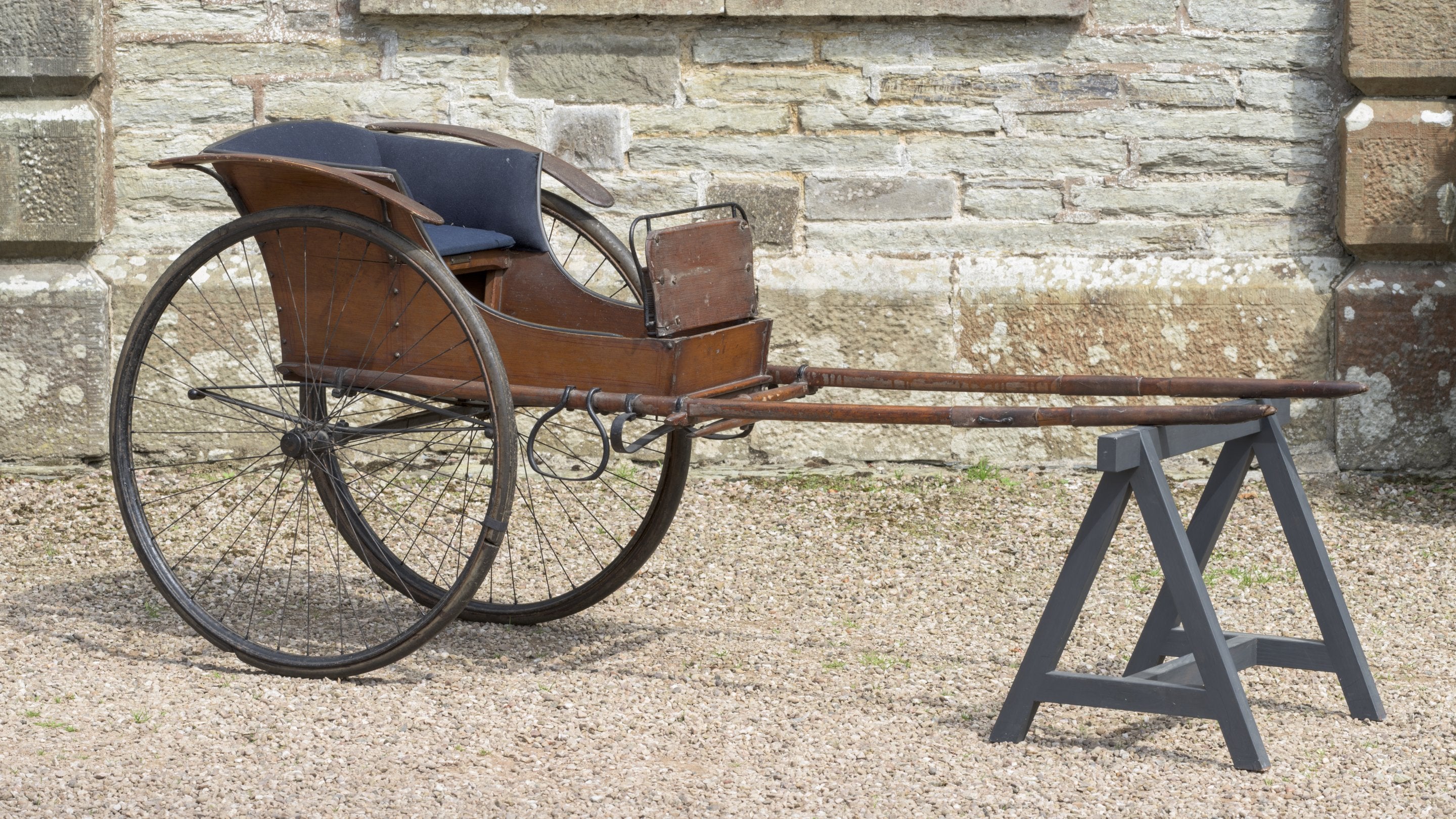 An 19th-century two-wheeled child's carriage at Arlington Court and the National Trust Carriage Museum, Devon