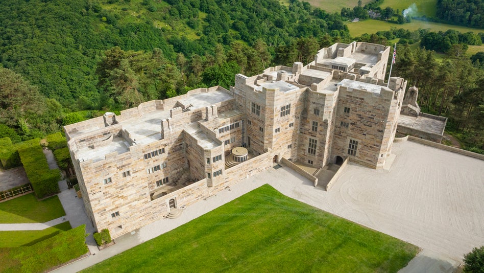 View from above the castle, the castle is surrounded by a wooded gorge and dartmoor