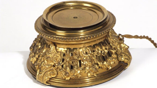 Julius Drewe's teacup warmer on a white background