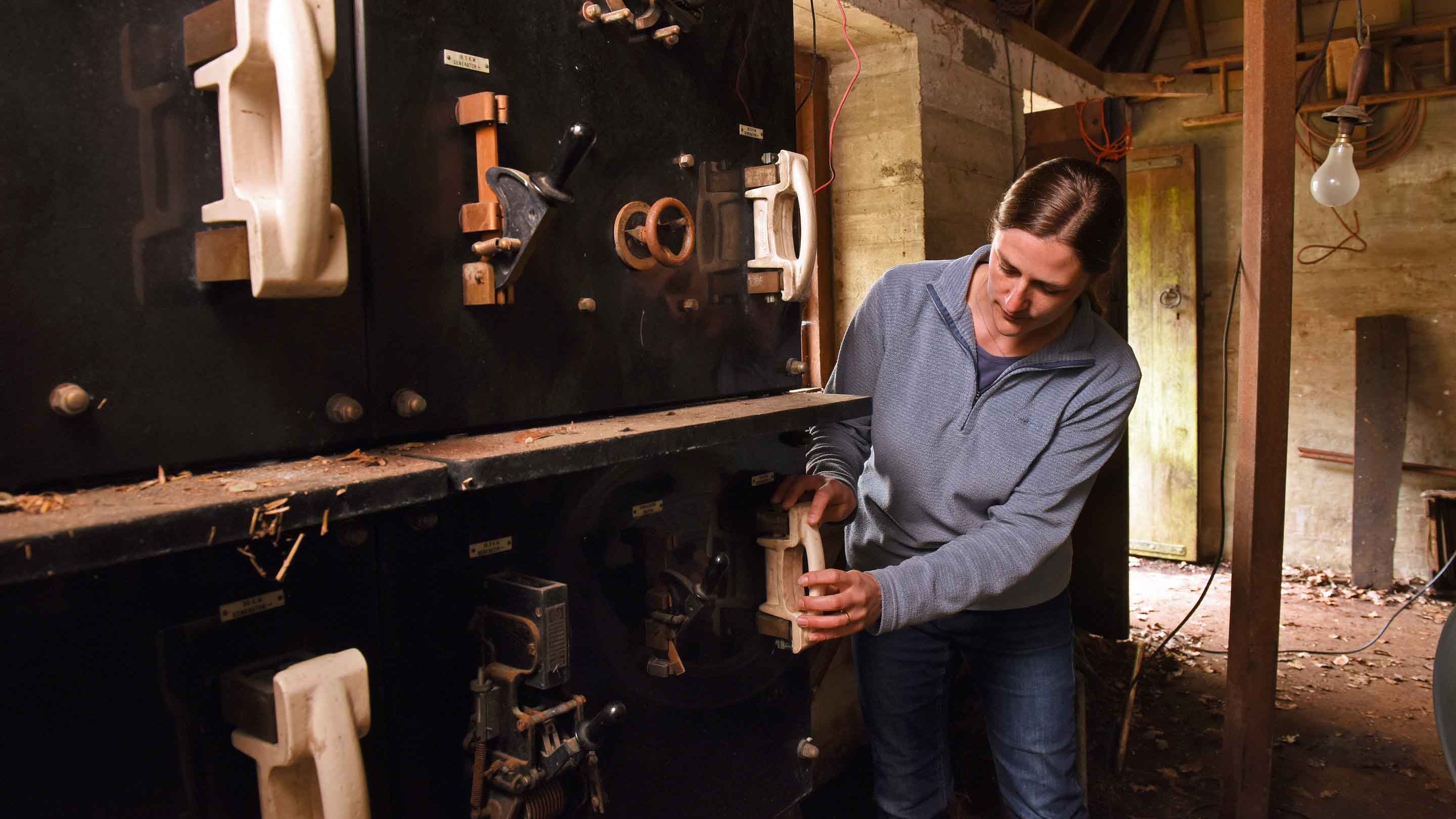 Engineer Yvette Elliott works inside the Turbin House at Castle Drogo, Devon