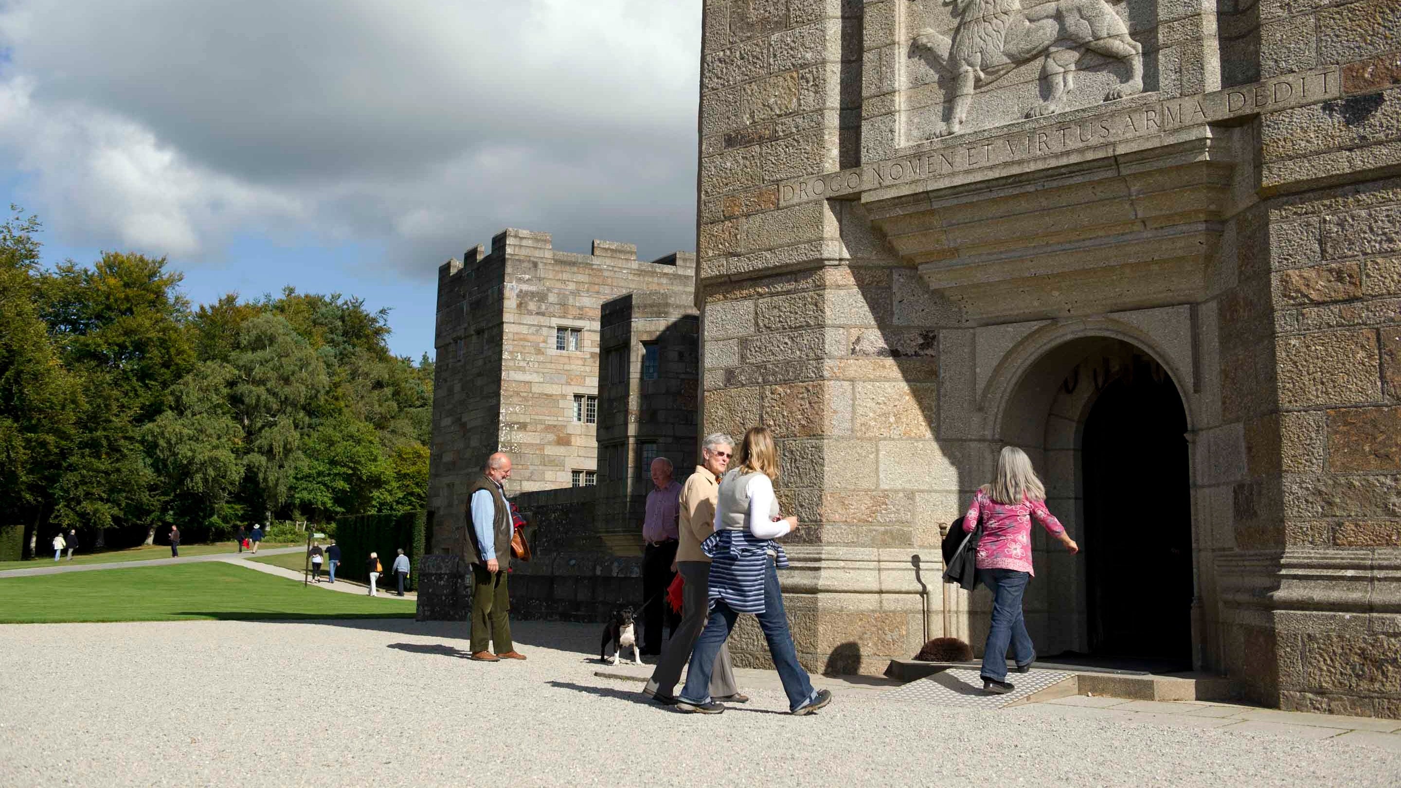 Visitors make their way through the entrance into Castle Drogo, Devon