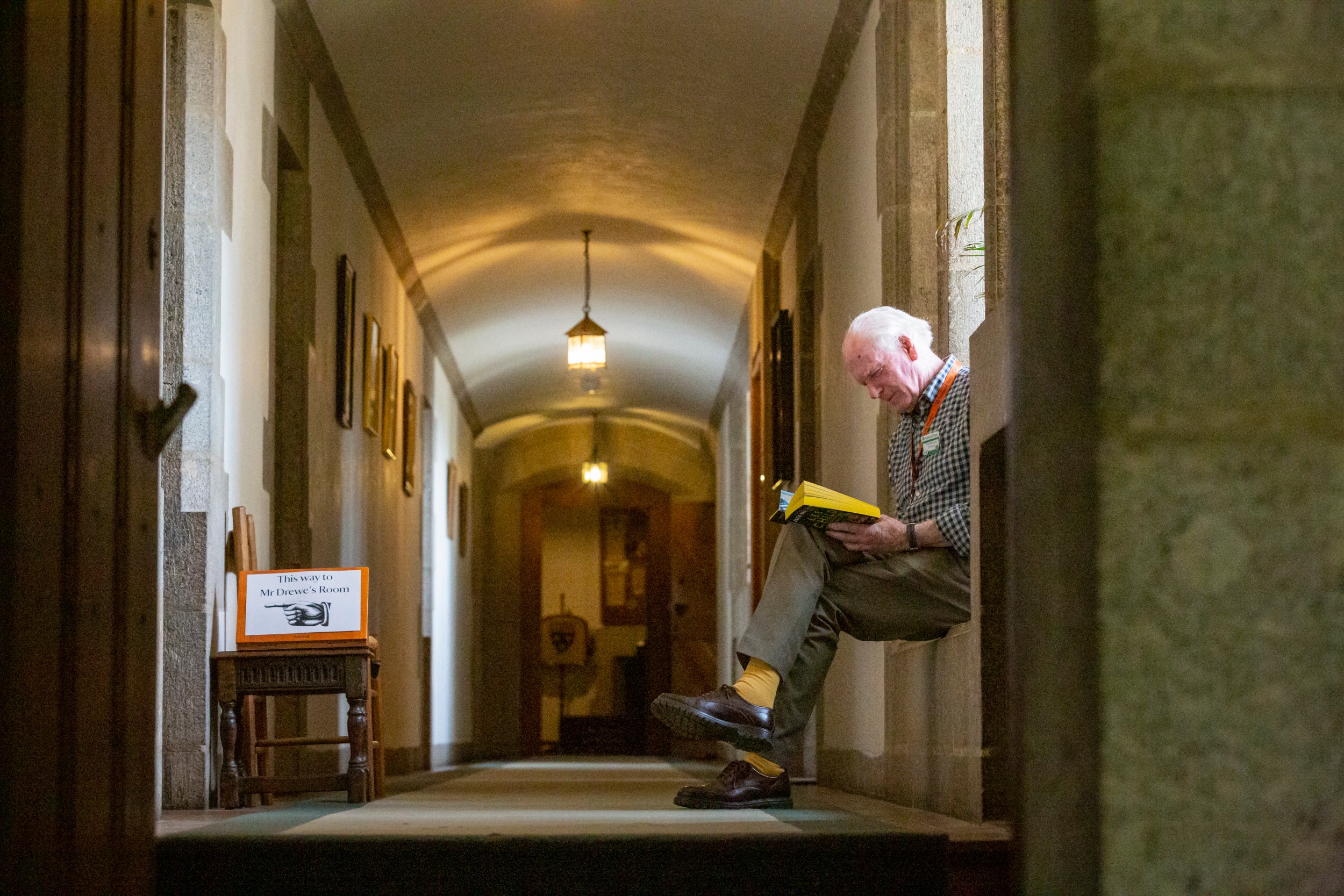 Volunteer reading on the Green corridor
