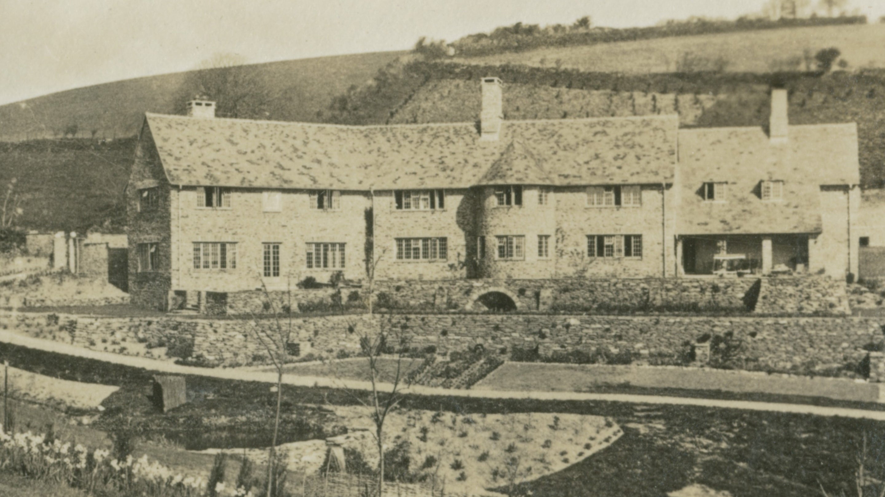 Archive image of the stone house at Coleton Fishacre with newly landscaped gardens and terraces