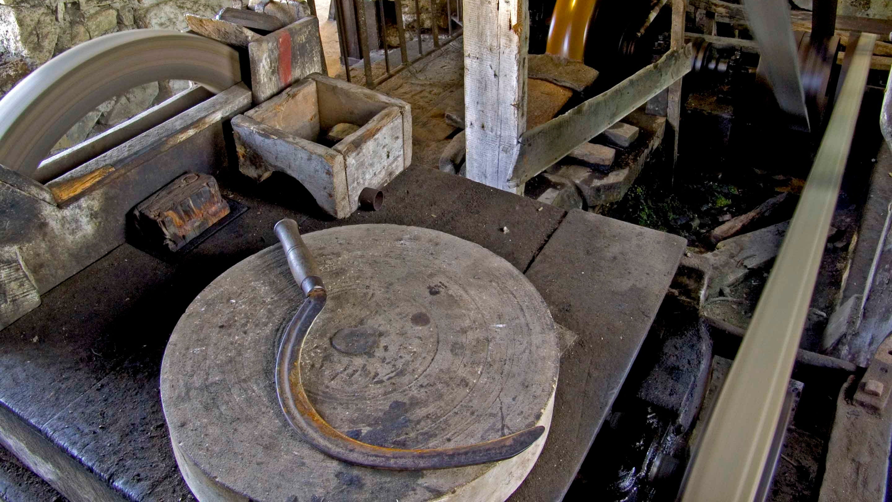 The pulley mechanism operated by the waterwheel which powers the grinding wheel at Finch Foundry, Devon