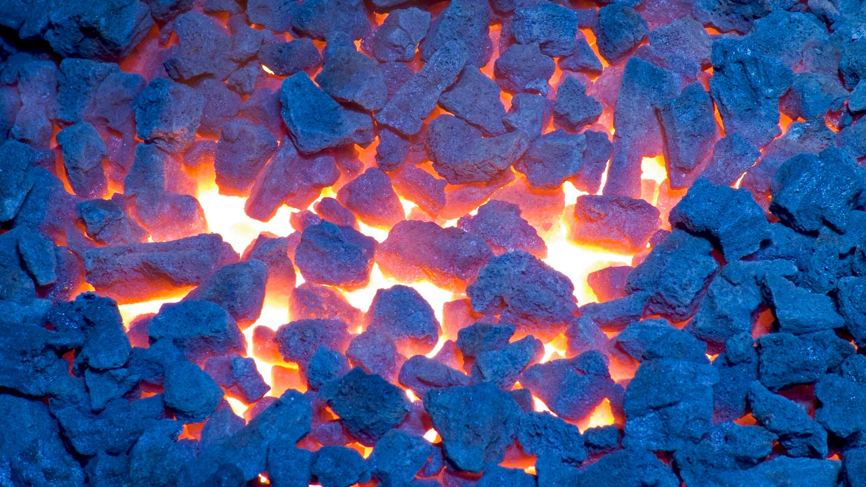 A close-up of glowing coal embers