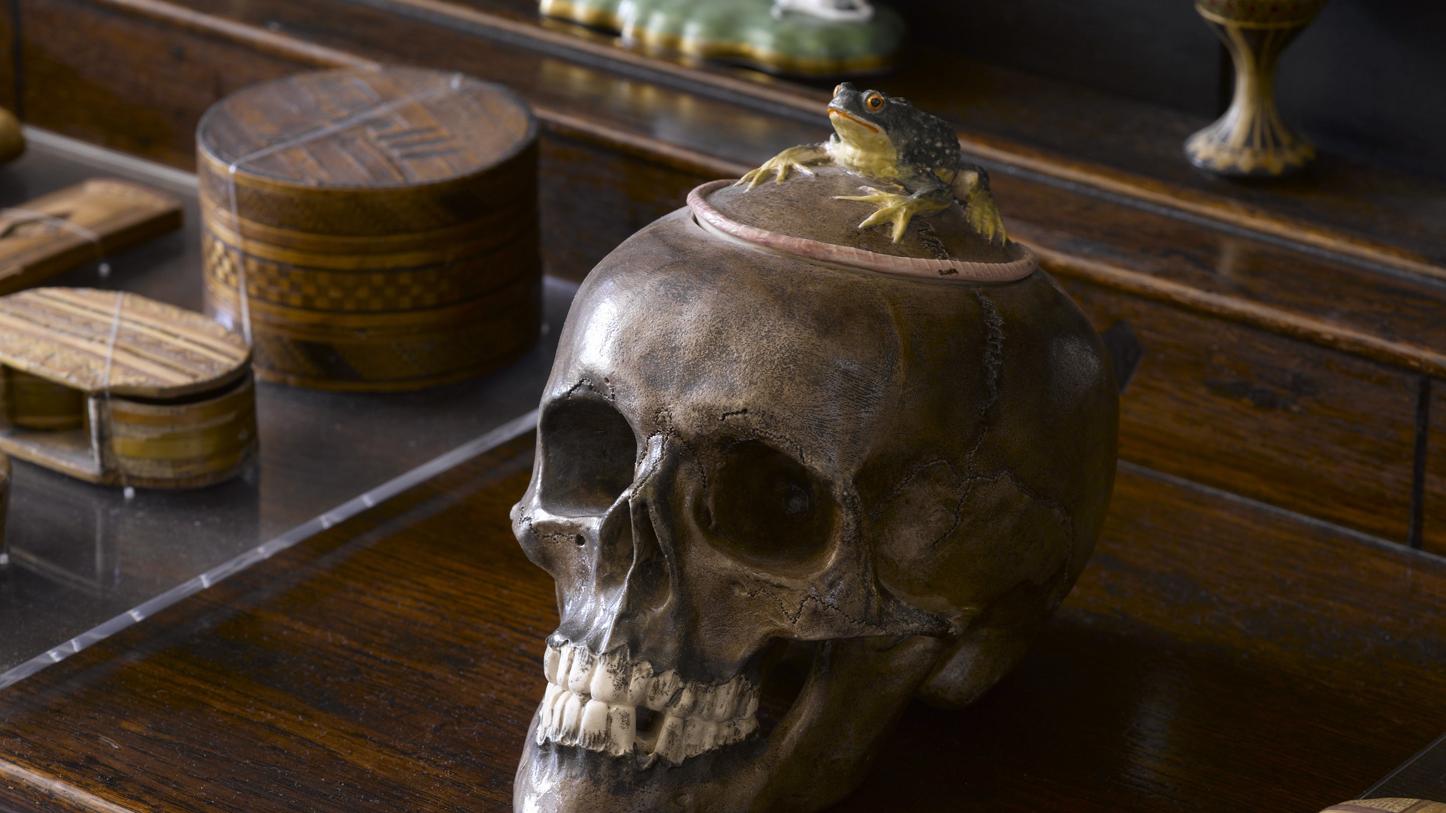 Japanese porcelain jar and cover modelled as a skull topped by a frog, on the dresser in the Entrance Hall at Greenway, Devon