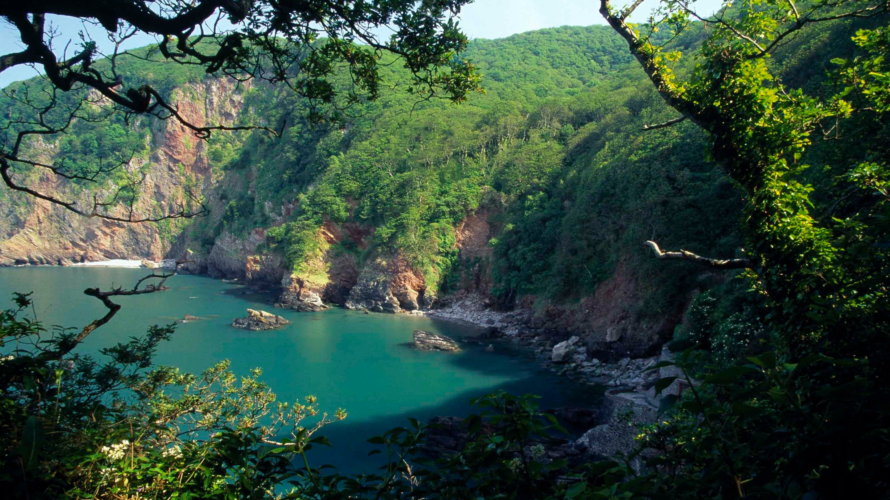 View looking down at the coastline and beach at Woody Bay, North Devon