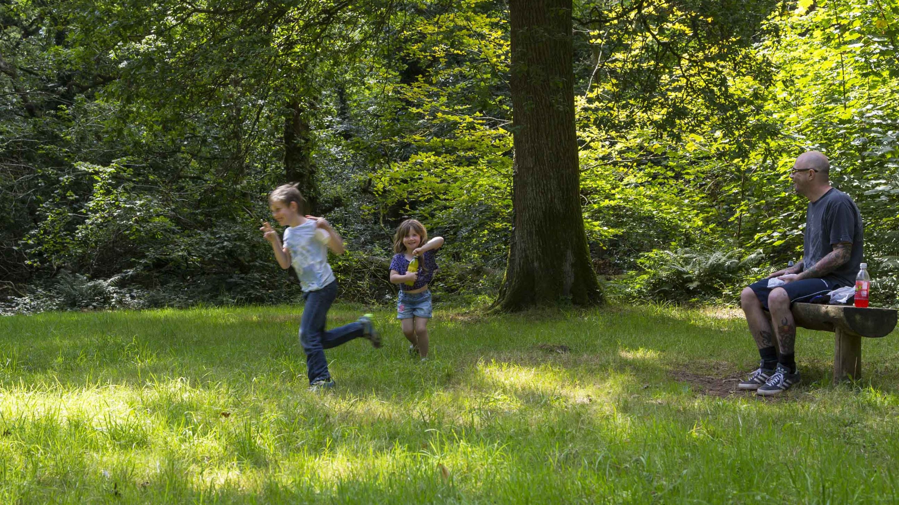 Two children playing in the grounds at Killerton, Devon