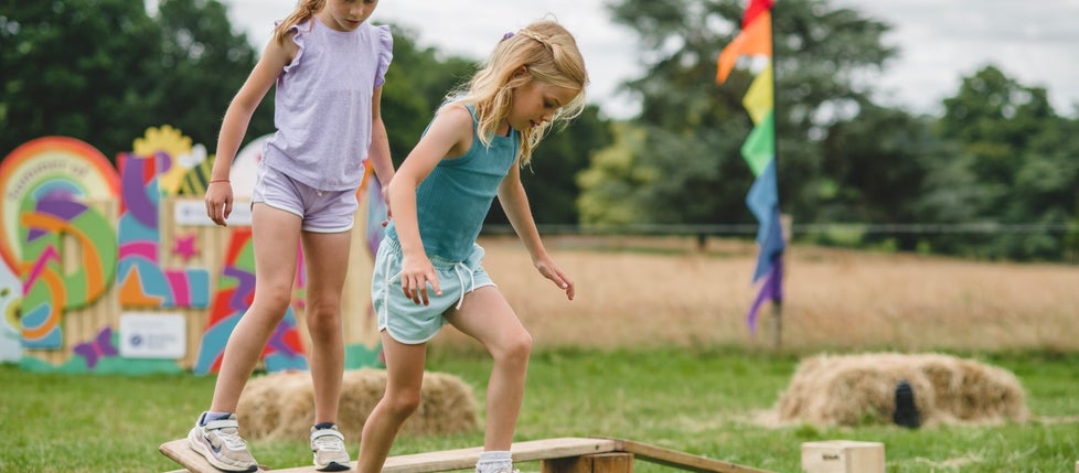 Children playing on balance equipment at Killerton