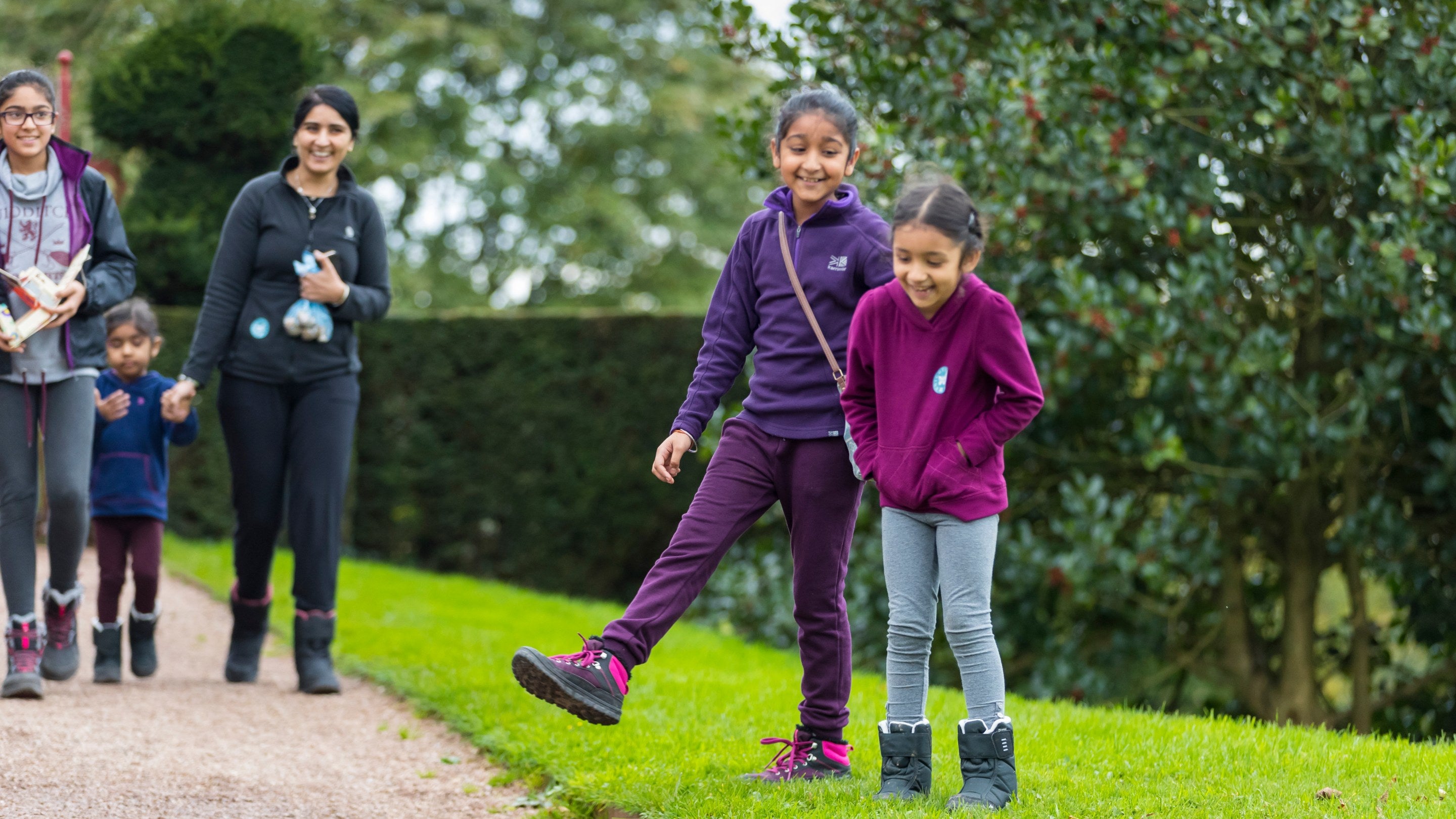 Visitors in the garden in autumn at Knightshayes, Devon