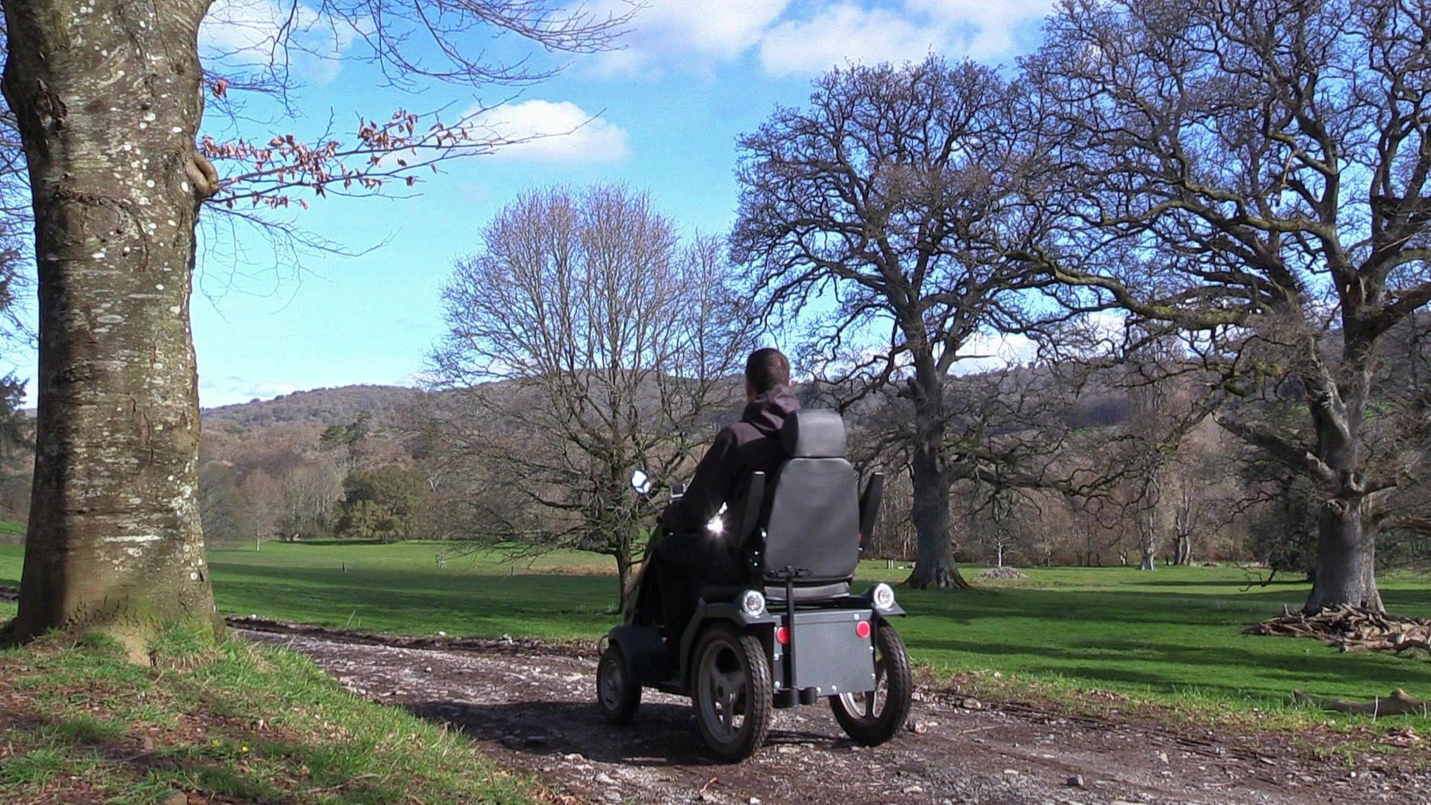 A visitor exploring Parke on a Tramper mobility scooter