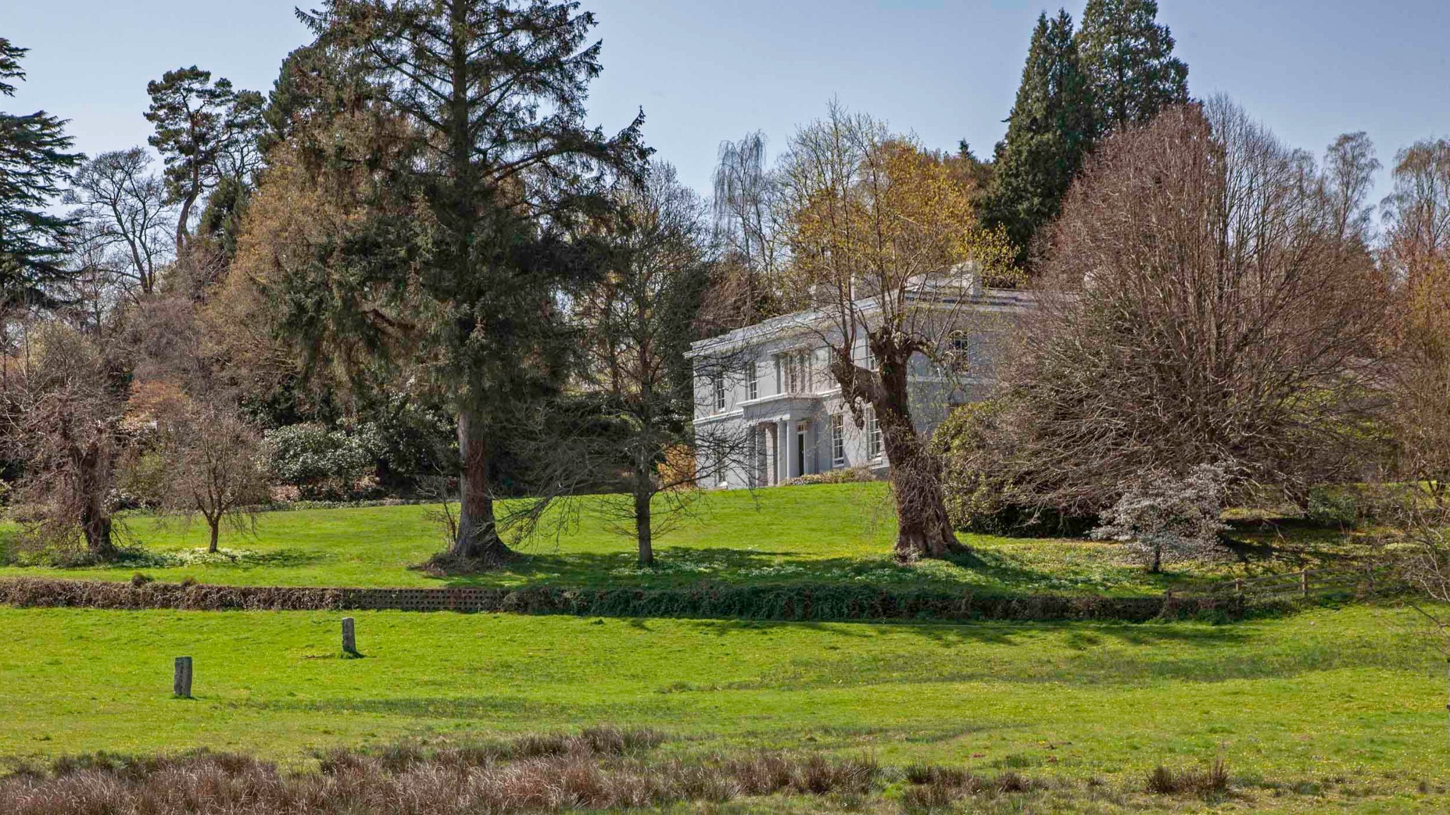 The exterior of the house at Parke surrounded by the gardens in spring