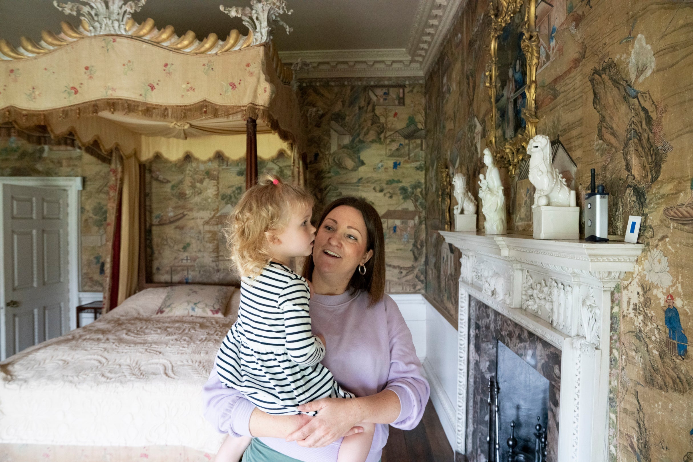 Mother and daughter enjoy exploring Saltram house and looking at the Chinese Wallpaper