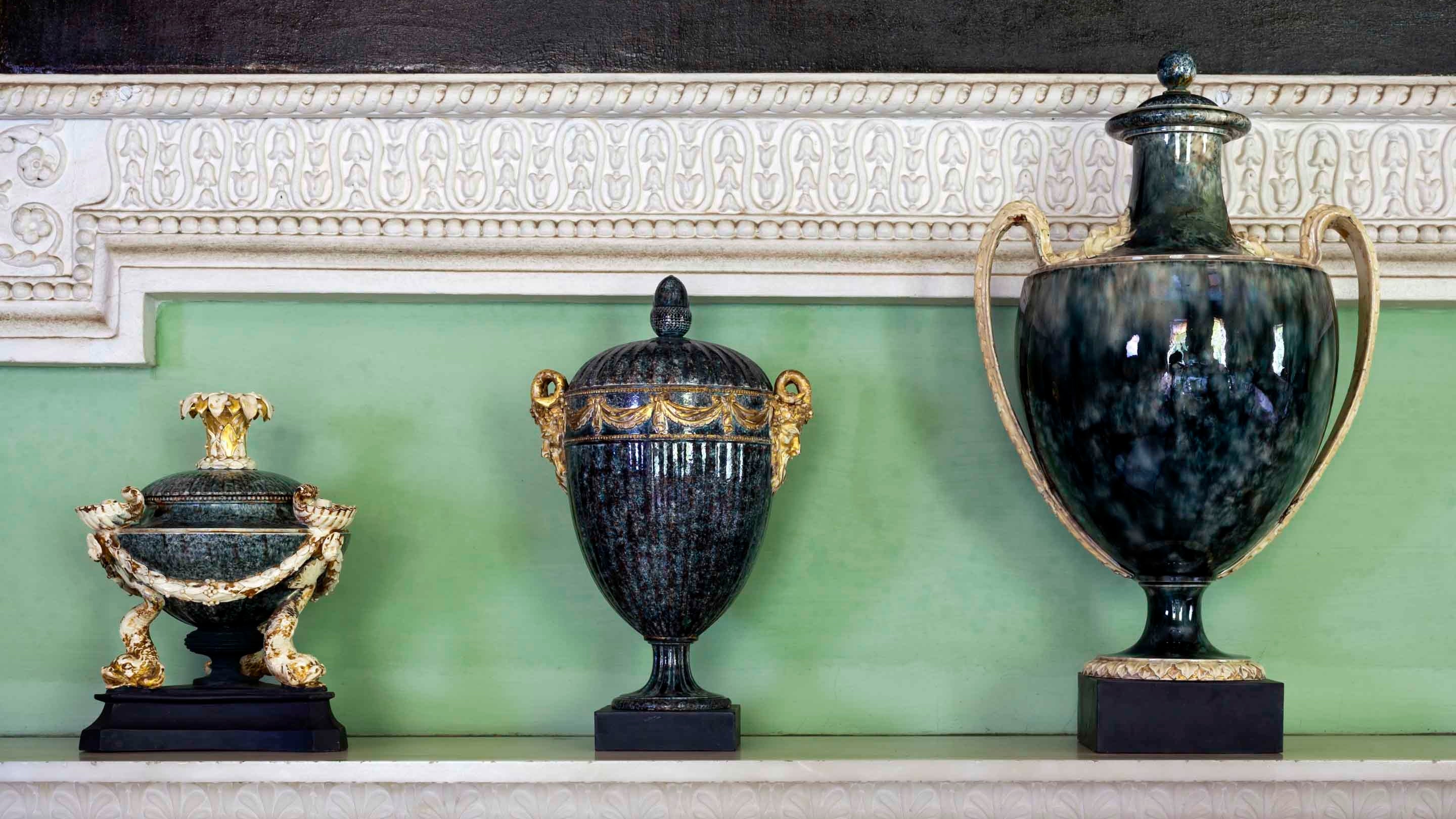 Three pieces of Wedgwood garniture, from around 1775-80, sat on a mantlepiece in Saltram house, Devon